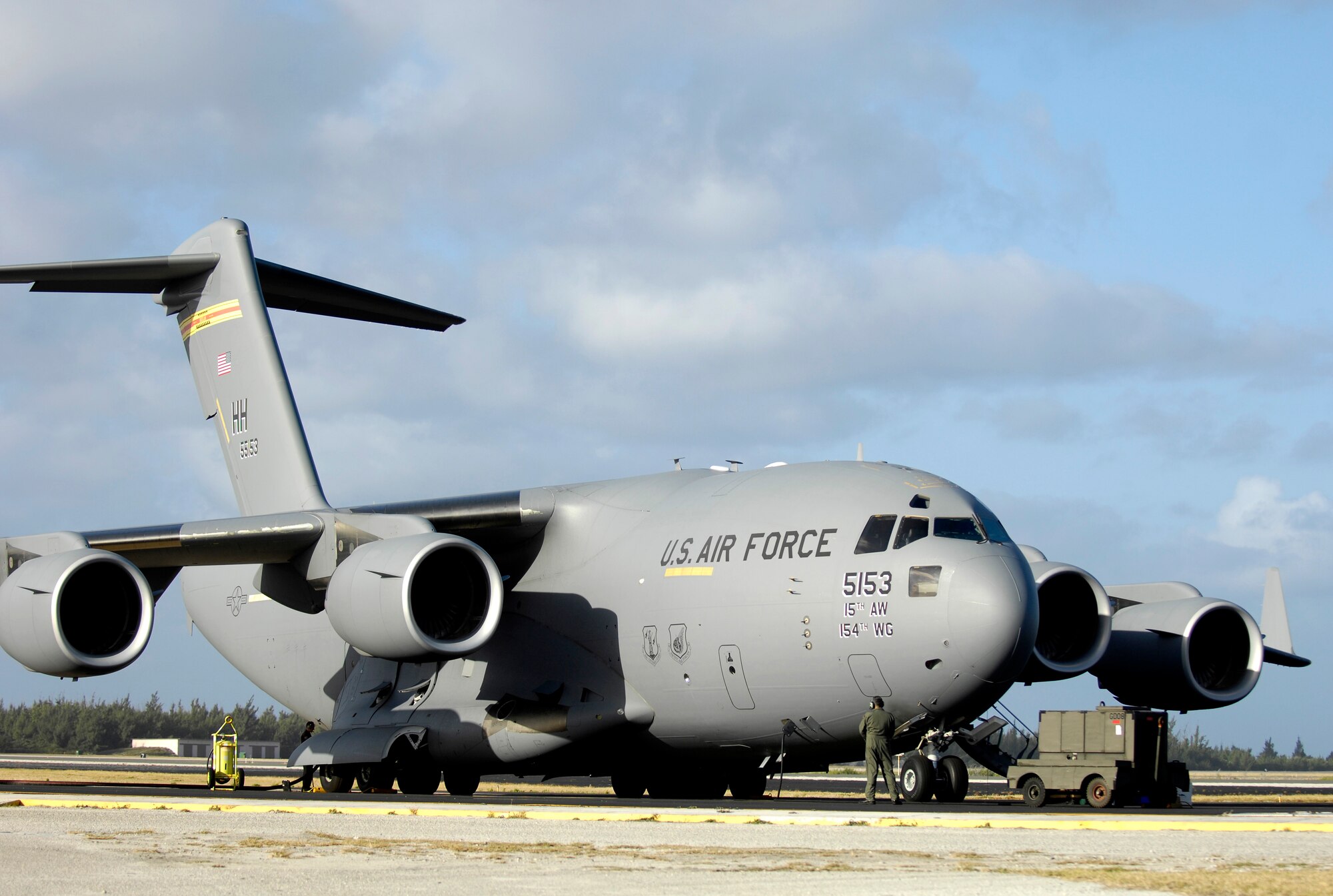 A C-17 Globemaster III sits on the flightline at Wake Island Jan. 12, 2008. The C-17, from the 15th Airlift Wing, Hickam Air Force Base, Hawaii, brought members of Pacific Air Forces headquarters to conduct a site survey of the island. (U.S. Air Force photo/TSgt. Shane A. Cuomo)  