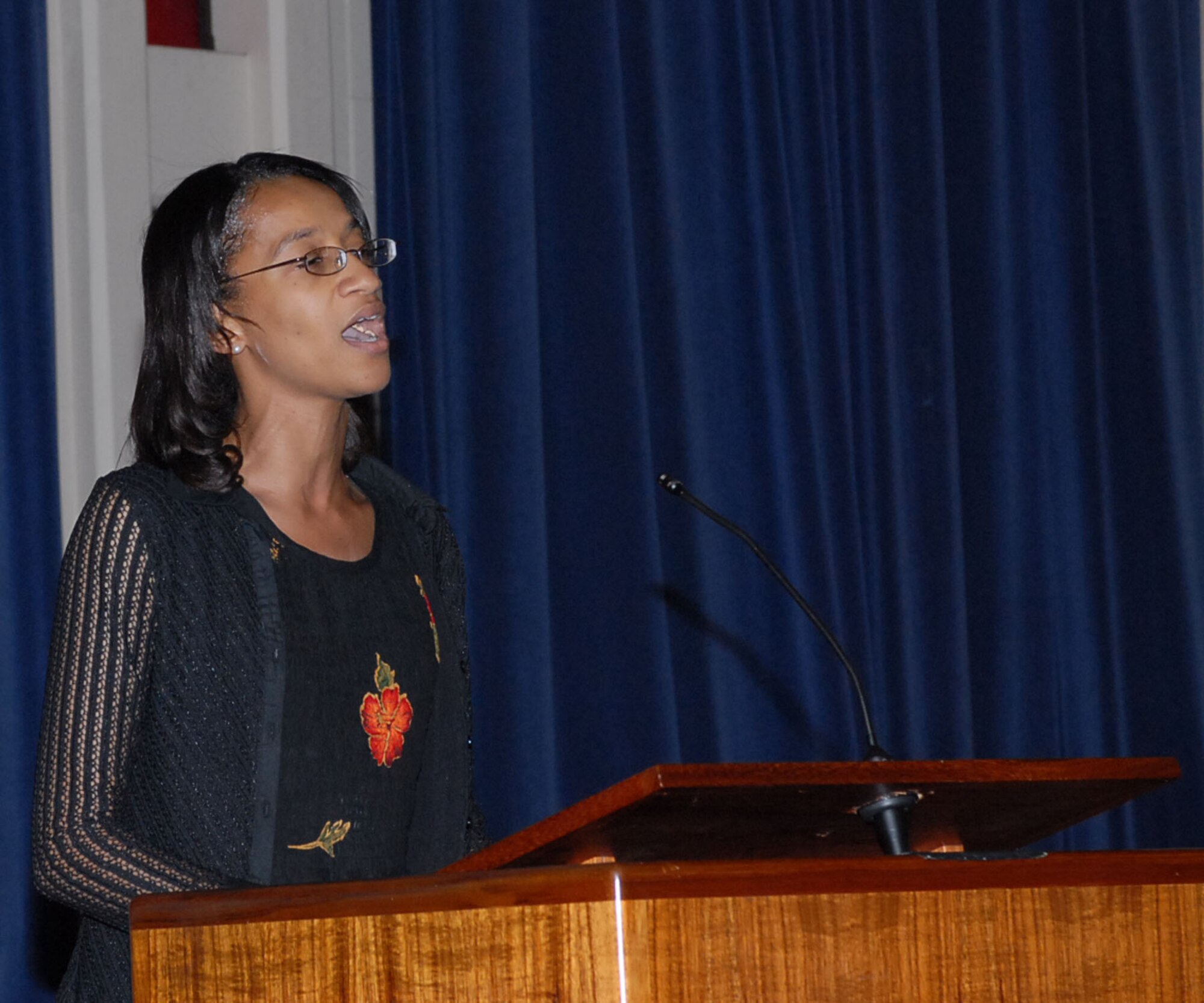 Suzane Uzzell sings "Precious Lord" at the beginning of the MLK Observance ceremony Jan. 16 at the base chapel. Photo by Oscar Hernandez