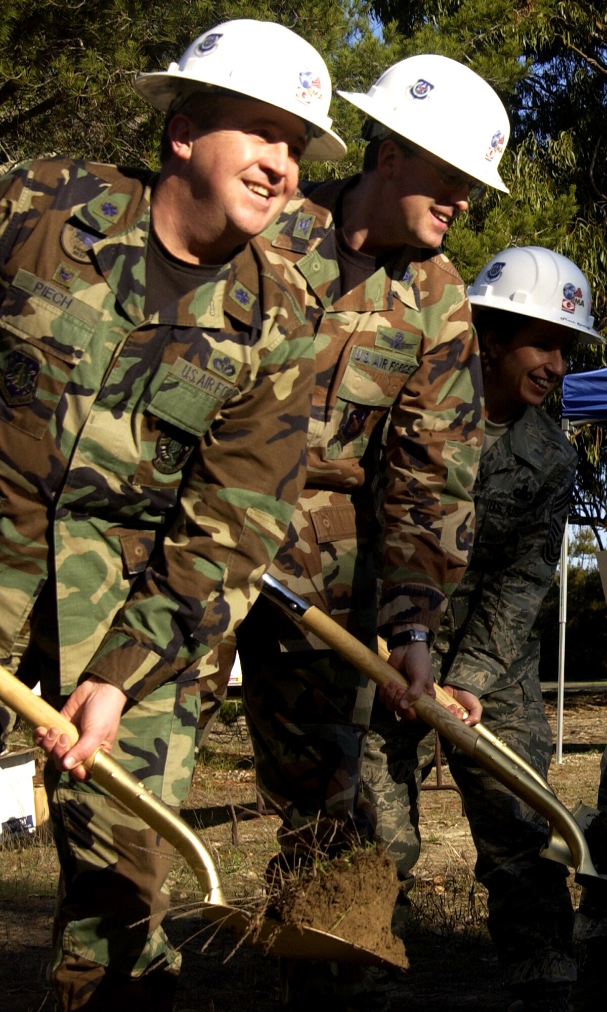 VANDENBERG AIR FORCE BASE, Calif. -- Lt. Col. David Piech 30th Civil Engineer Squadron commander (left), Col. Benjamin Huff, 30th MSG commander (center) and Command Chief Master Sgt Cari Kent of the 30th Space Wing (right) break the ground at the new fitness center site on Jan. 16. The new base fitness center is slated to open in the spring of 2009. (U.S. Air Force photo / A1C Christopher Hubenthal)