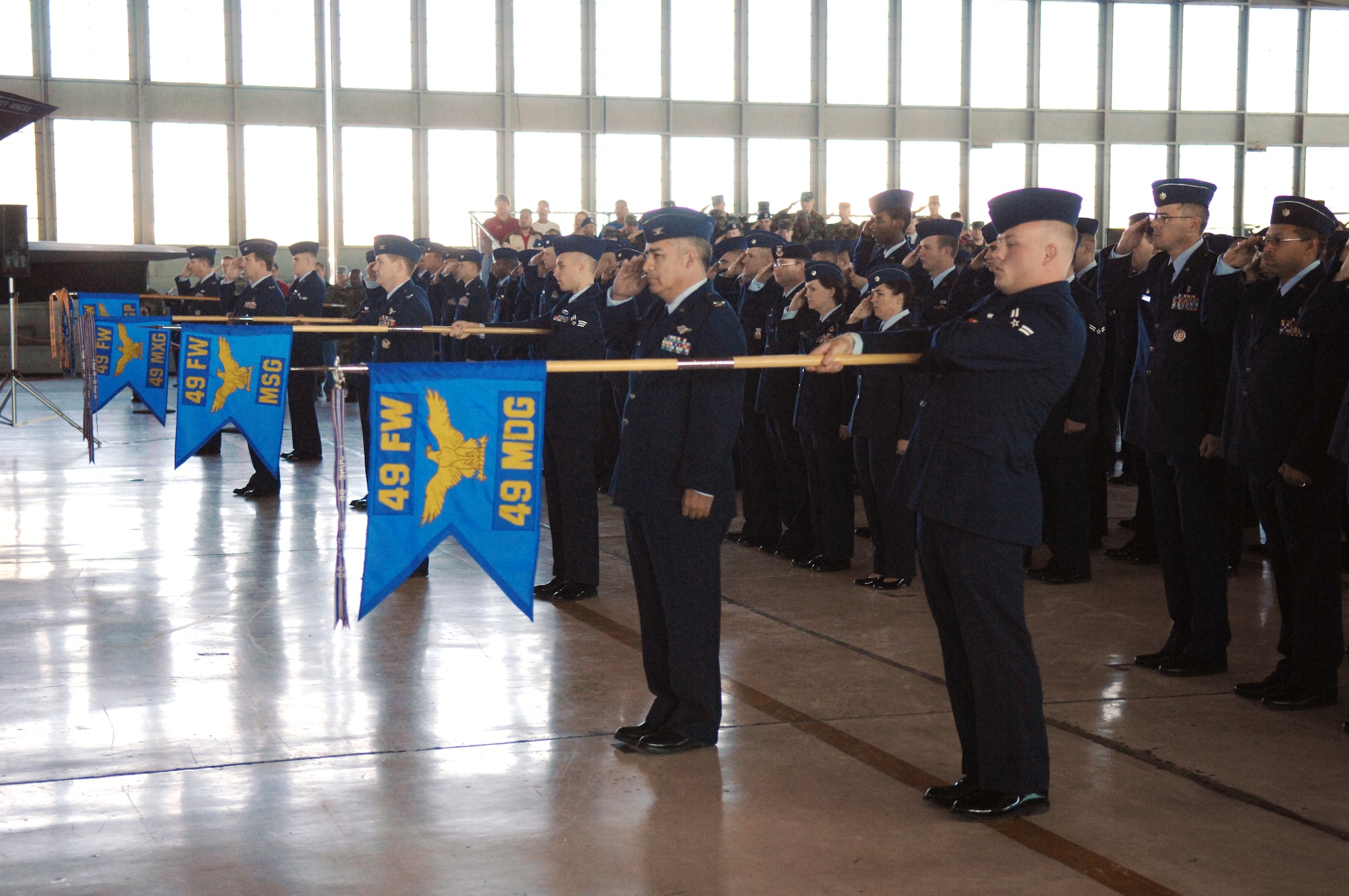 Members from various base squadrons and groups hold the guide don's during the 49th Fighter Wing change of command ceremony Jan. 11, 2008, at Holloman Air Force Base, N.M. The ceremony was attended by members of Team Holloman and visitors from Alamogordo, White Sands and Las Cruces, N.M., and Fort Bliss, Texas. (U.S. Air Force photo/Senior Airman Anthony Nelson Jr) 