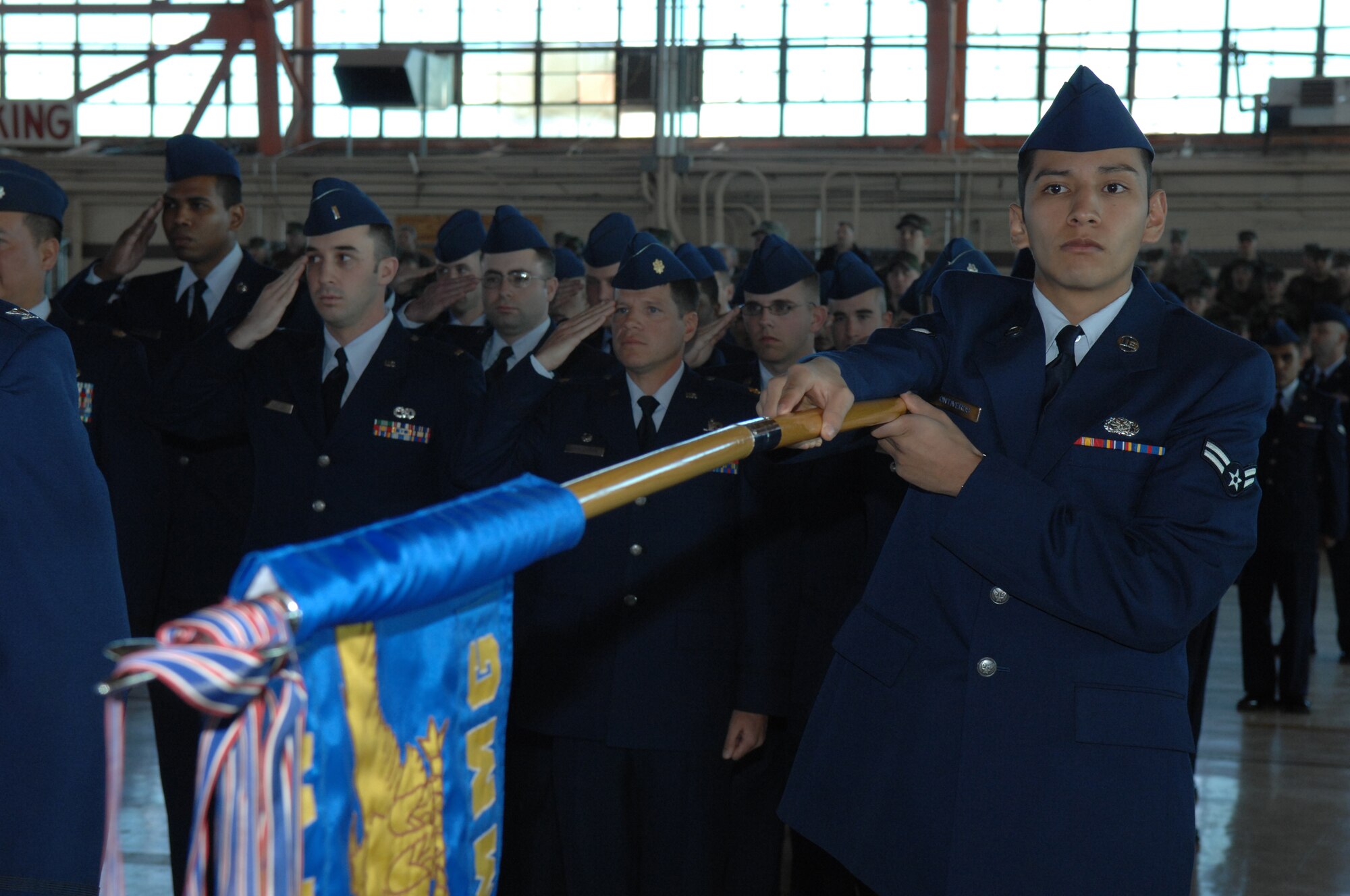 Airman 1st Class Jorge Ontiveros holds the guide don for the 49th Material Maintenance Group during the 49th Fighter Wing change of command ceremony Jan. 11, 2008, at Holloman Air Force Base, N.M. The ceremony was attended by members of Team Holloman and visitors from Alamogordo, White Sands and Las Cruces, N.M., and Fort Bliss, Texas. (U.S. Air Force photo/Senior Airman Anthony Nelson Jr) 