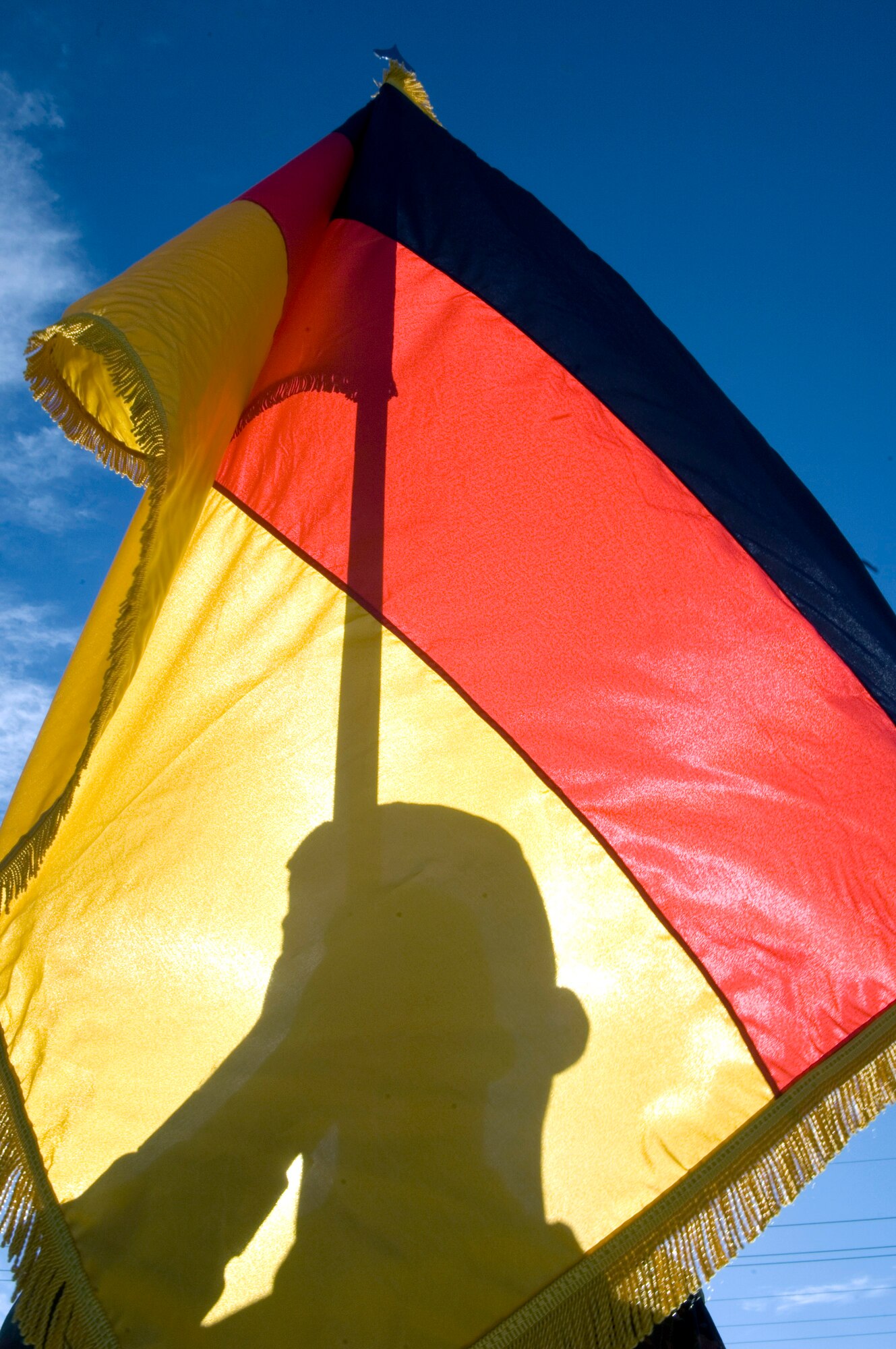 German air force Senior Airman Steffen Hanke holds the German flag while training with U.S. Air Force honor guard members of the 49th Mission Support Squadron Jan. 15 at Holloman Air Force Base, N.M. Airman Hanke was selected to join the base honor guard team and has more than seven years of honor guard experience with the German air force. Holloman AFB is host to the German Air Force Tactical Training Center with more than 300 German air force members stationed there. Germany is one of the strongest allies of the U.S. in NATO and the joint training is important for allied armed forces to train together to ensure effectiveness when called upon to serve together. (U.S. Air Force photo/Staff Sgt. Bennie J. Davis III) 