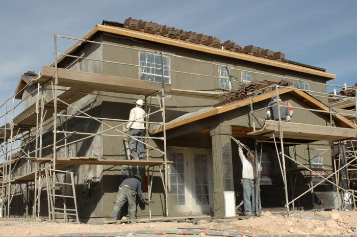 Construction crews build one of the new homes as part of the ongoing Nellis housing privatization project here, Dec. 12, 2007.  A town hall meeting held Jan. 15 updated housing residents on demolition and construction relating to the project, which began in the fall of 2007 and is scheduled for completion in 2012. The new communities will feature larger homes, basketball courts, playgrounds, picnic areas, a swimming pool, a splash park and a soccer field. (U.S. Air Force photo by Senior Airman Nadine Y. Barclay)