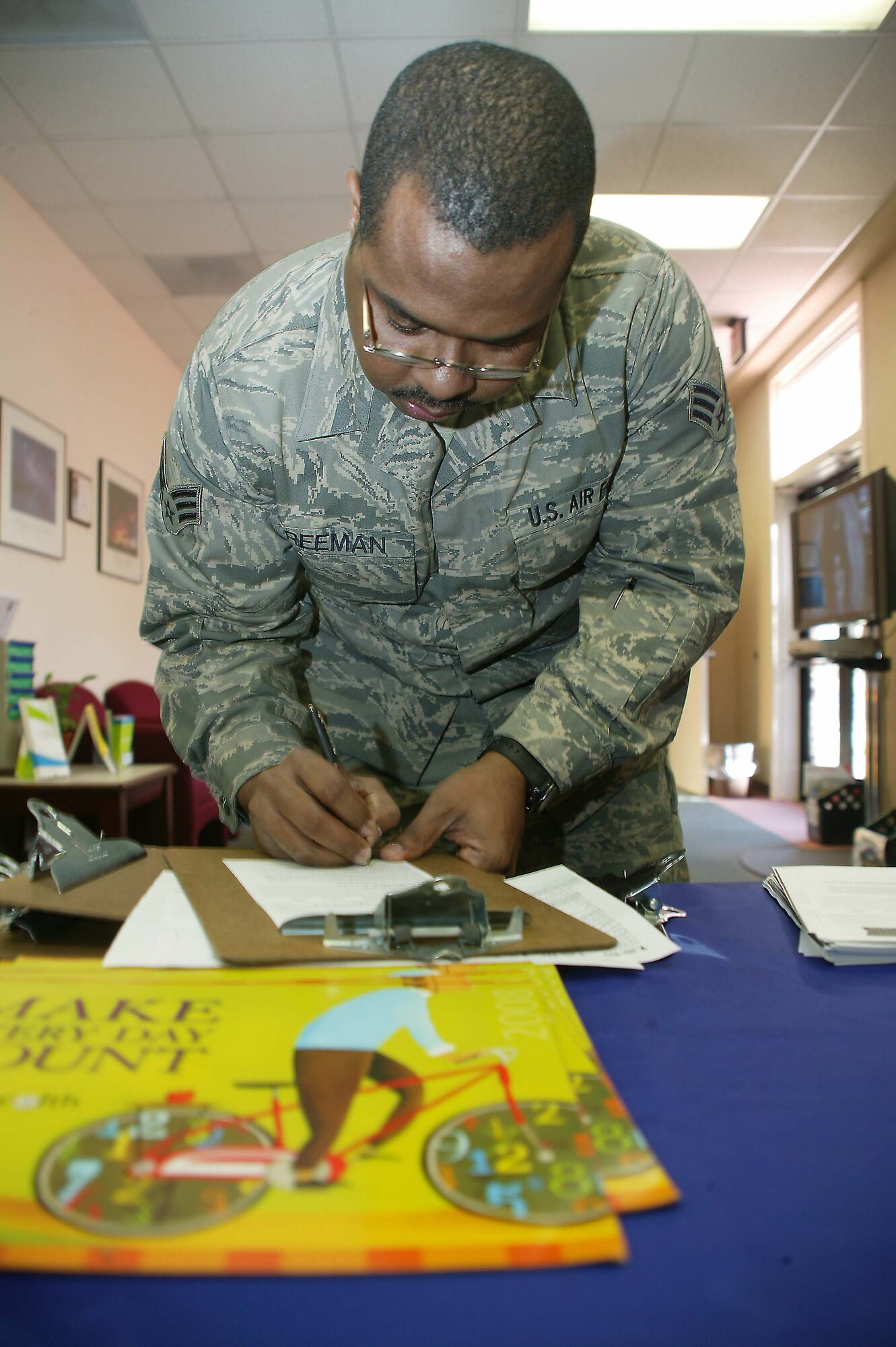 SHAW AIR FORCE BASE, S.C. -- Senior Airman Anthony Freeman, 20th Fighter Wing, signs up for the Activate Sumter program at the Health and Wellness Center Jan. 14. The program assists members who want to lose a few pounds through nutrition education, recipes and fitness. (U.S. Air Force photo/Staff Sgt. John Gordinier)