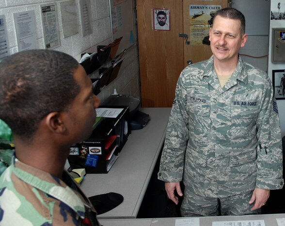 Senior Master Sgt. James Scheppard, 99th Security Support Squadron first sergeant, speaks to a bay orderly about daily tasks here, Jan. 11. Sergeant Scheppard was one of the few who were recently selected for promotion out of cycle by the Supplemental Chief Selection Board. (U.S. Air Force photo by Staff Sgt. Scottie McCord)