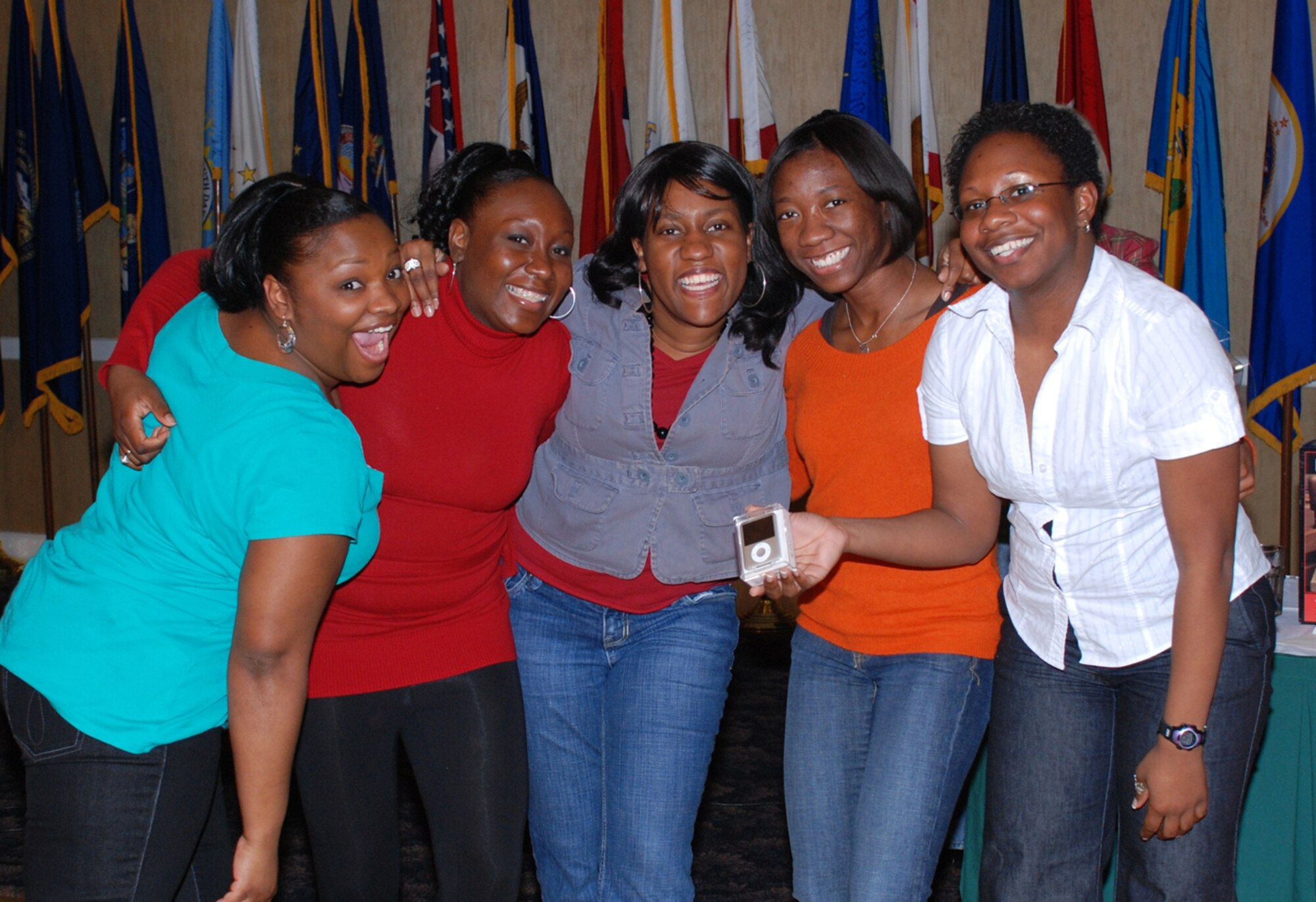 Staff Sgt. Aneeya Fields, 14th Medical Support Squadron, Tech. Sgt. Kimona Woodard, 14th MDSS, Tynisa Eleby,14th Mission Support Group, Capt. Teneshia Nelson, 14th Medical Operations Squadron, and Capt. Christina Peace, 14th MDOS, combined their earnings to win the IPOD Nano at Monte Carlo Night Friday. (U.S. Air Force photo)
