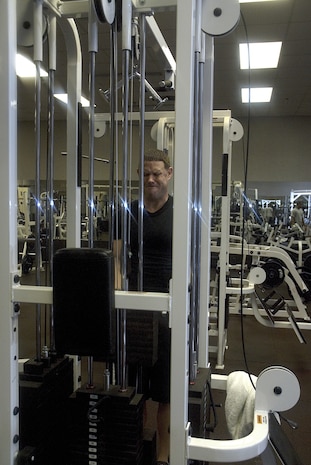 Tech. Sgt. Shawn McKeen, 437th Service Squadron Fitness and Sport Center NCOIC, lift weights in the free weight room Jan 15.  The center has more than 40 pieces of equipment to help Team Charleston Airmen stay fit.  (U.S. Air Force photo by Staff. Sgt. Jennifer Arredondo)