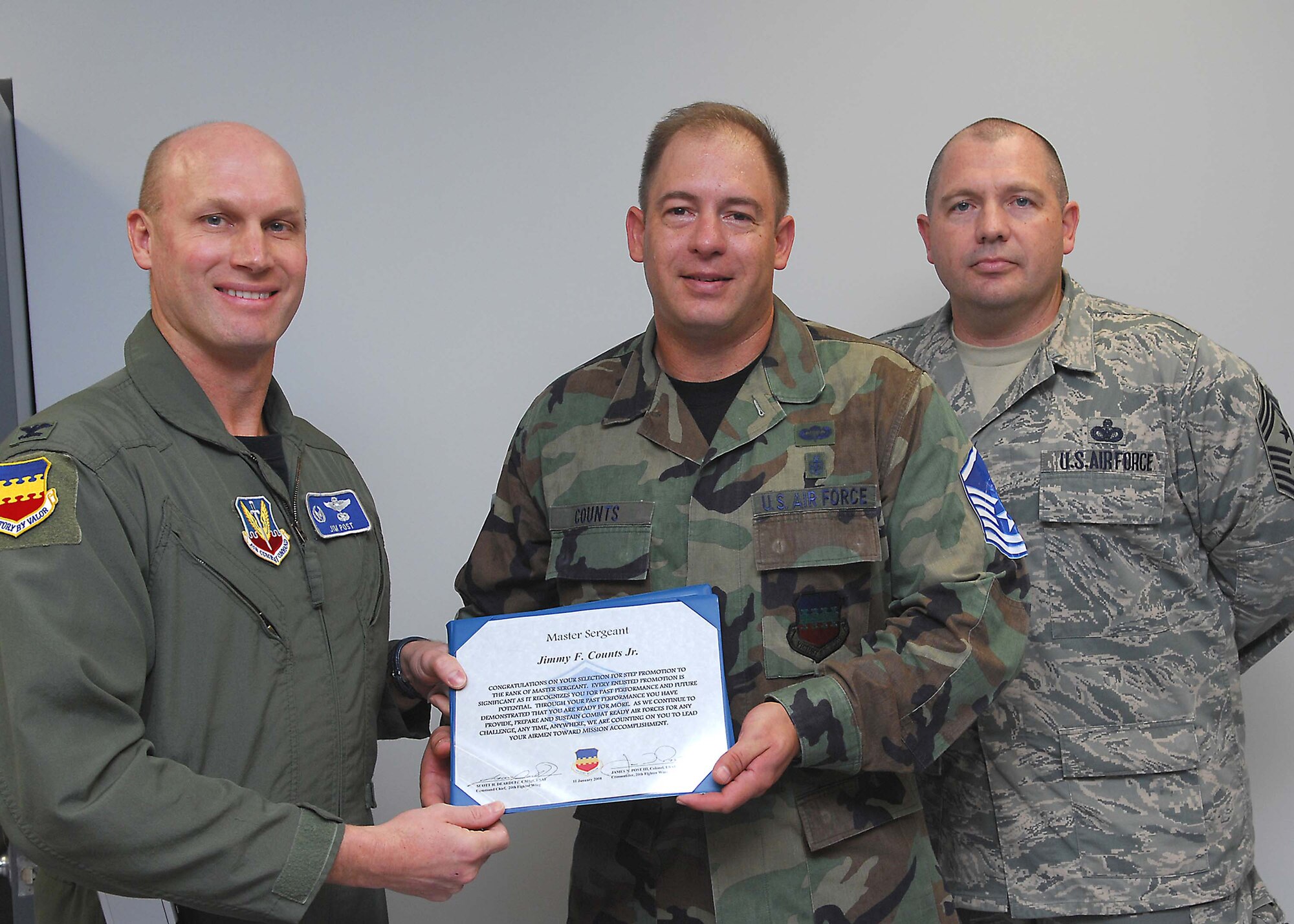 SHAW AIR FORCE BASE, S.C. -- Col. James Post, 20th Fighter Wing commander, and Chief Master Sgt. Scott Dearduff, 20th Fighter Wing command chief, congratulate Master Sgt. Jimmy Counts, 20th Aerospace Medicine Squadron, for earning his promotion through Stripes for Exceptional Performers promotion Jan. 11. (U.S. Air Force photo/Airman 1st Class William Coleman)