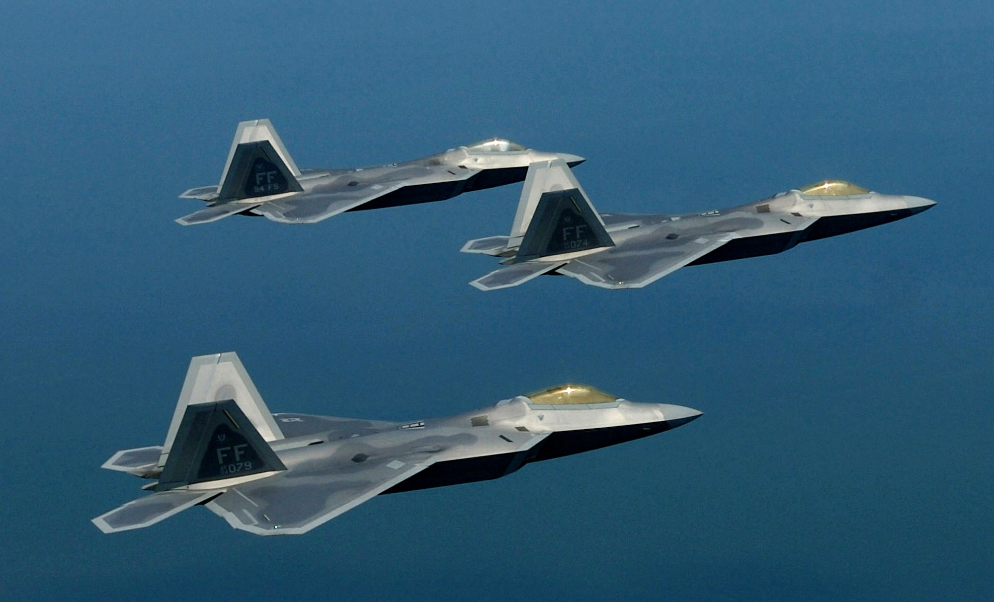 F-22 Raptors fly in formation. The Air Force's first four pilots to go directly to the F-22 without previous fighter experience are currently training at Luke Air Force Base, Ariz., in preparation for taking on the F-22. (U.S. Air Force photo/Staff Sgt. Samuel Rogers) 
