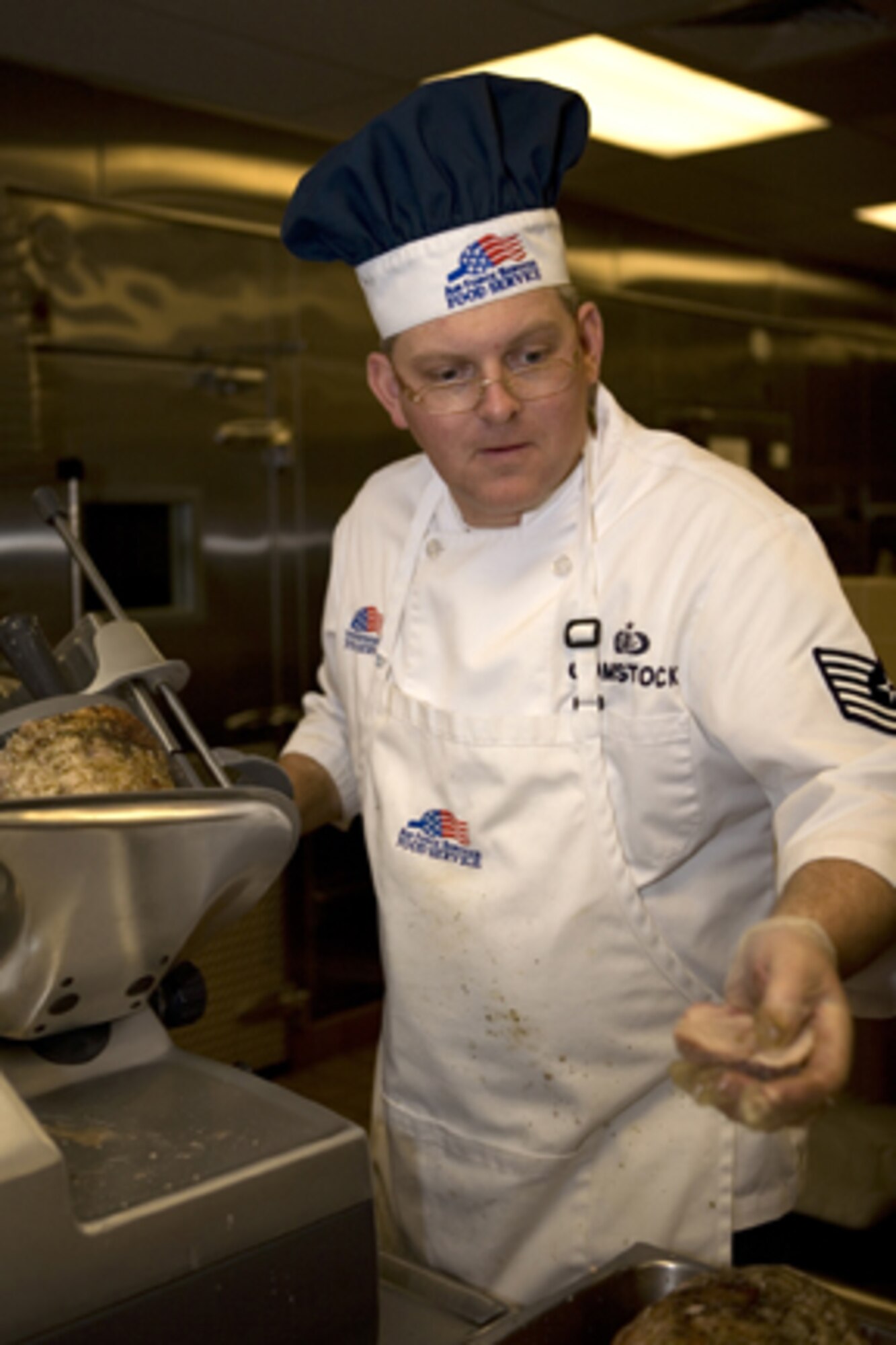 GRISSOM AIR RESERVE BASE, Ind.,-- Tech. Sgt. Edward Comstock, a food service specialist with the 434th Services Flight, slices turkey in preparation for  dinner during a unit training assembly. The 434th Services Flight will be competing for the John L. Hennessy Trophy which is awarded to the best food-service program in the Air Force. (U.S. Air Force photo/Senior Airman Omar Delacruz)