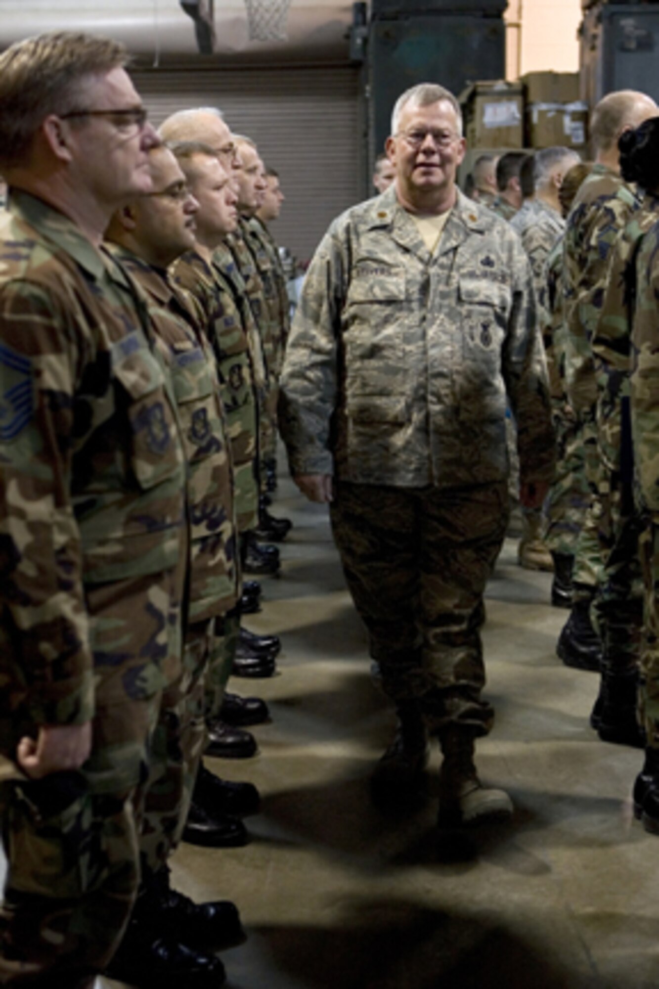 GRISSOM AIR RESERVE BASE, Ind.-- Maj. Randall Stivers (center), 434th Security Forces Squadron commander, reviews his troops in morning formation during a recent unit training assembly. Members of the SFS were awarded Air Force Achievement medals in recognition of their support of the Air Force mission.  (U.S. Air Force photo/Senior Airman Omar Delacruz)