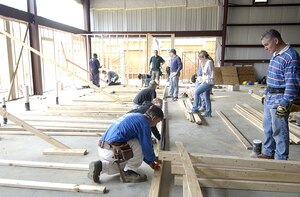 Members from the 437th Top Three took time out from their jobs to help Habitat for Humanity build a new Restore in Jedburg S.C., Jan. 11.  More than 20 members from Charleston AFB volunteered for the day.                               