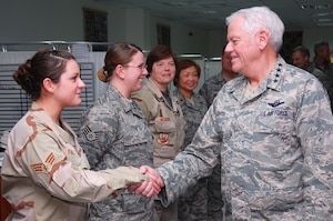 SOUTHWEST ASIA -- Gen. Arthur J. Lichte greets Senior Airman LizaMarie Franz,  386th Expeditionary Medical Group, here Jan. 7.  General Lichte, commander of Air Mobility Command, was making his first visit downrange since taking command in September.  (U.S. Air Force photo/Staff Sgt. Tia Schroeder)  