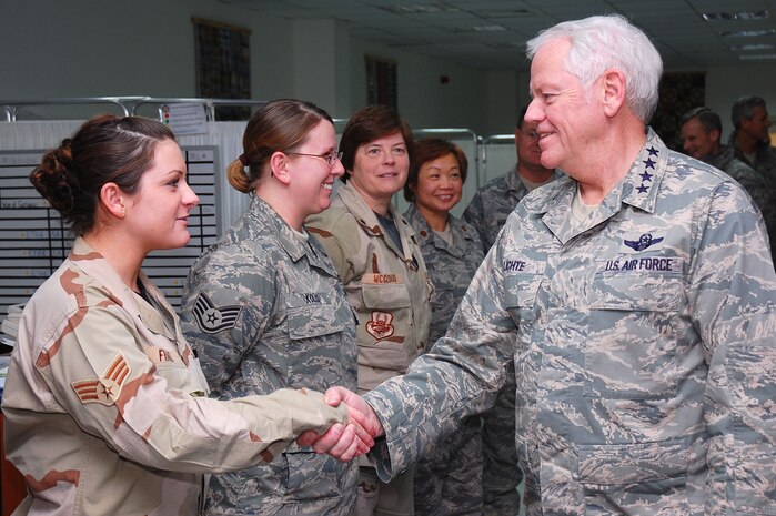 SOUTHWEST ASIA -- Gen. Arthur J. Lichte greets Senior Airman LizaMarie Franz,  386th Expeditionary Medical Group, here Jan. 7.  General Lichte, commander of Air Mobility Command, was making his first visit downrange since taking command in September.  (U.S. Air Force photo/Staff Sgt. Tia Schroeder)  