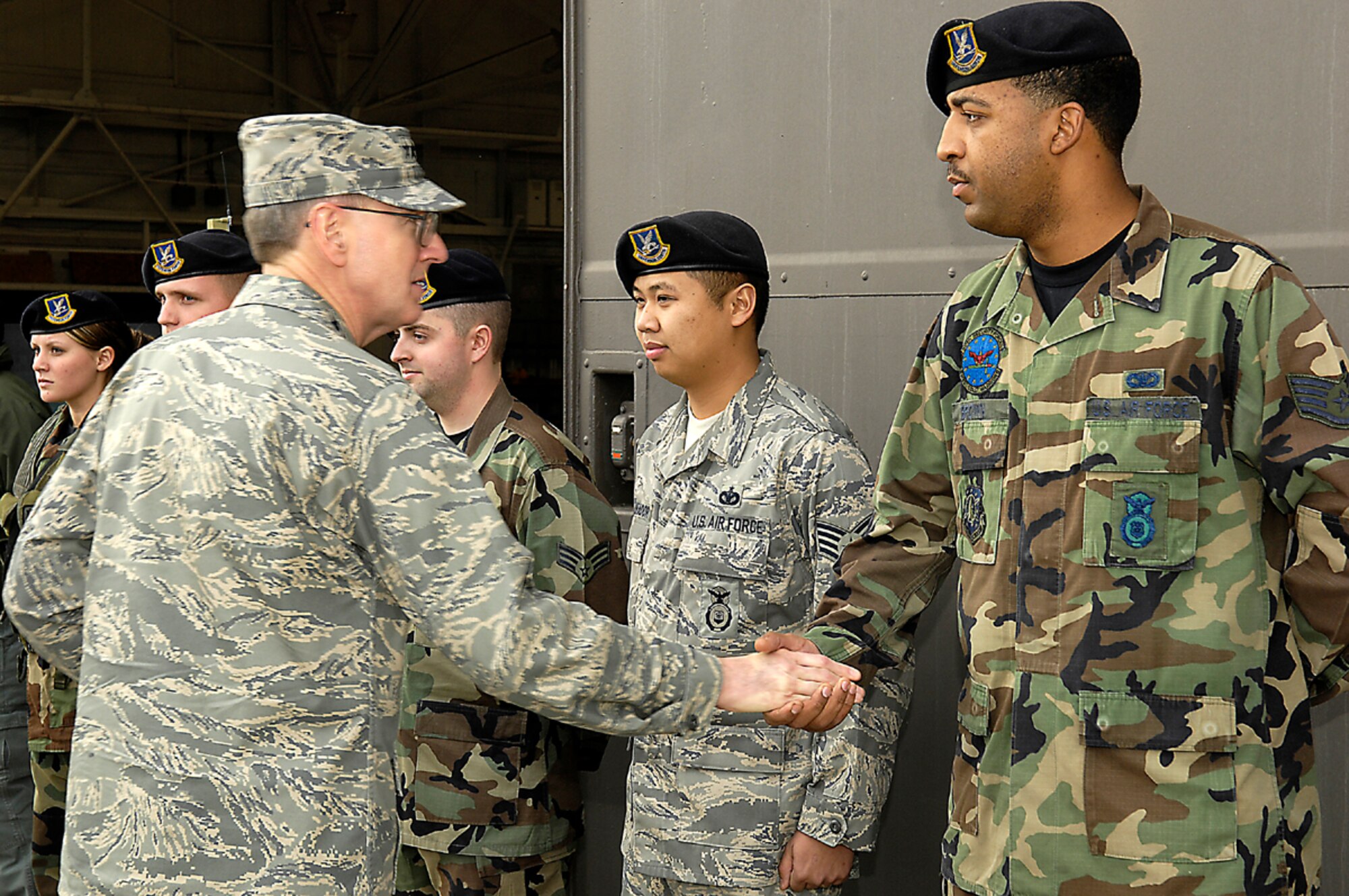VANDENBERG AIR FORCE BASE, CALIF. --  Gen. Robert Kehler, Air Force Space Command commander coins five members of Vandenberg's 30th Security Forces for their service while deployed to Iraq during his visit here Jan. 08. This was one of many visits General Kehler made during his one day stay at Vandenberg where he also met with base leadership and addressed questions concerning the future of the Air Force's mission and the future of Air Force Space Command. (U.S. Air Force photo/Airman 1st Class Matthew Plew)
