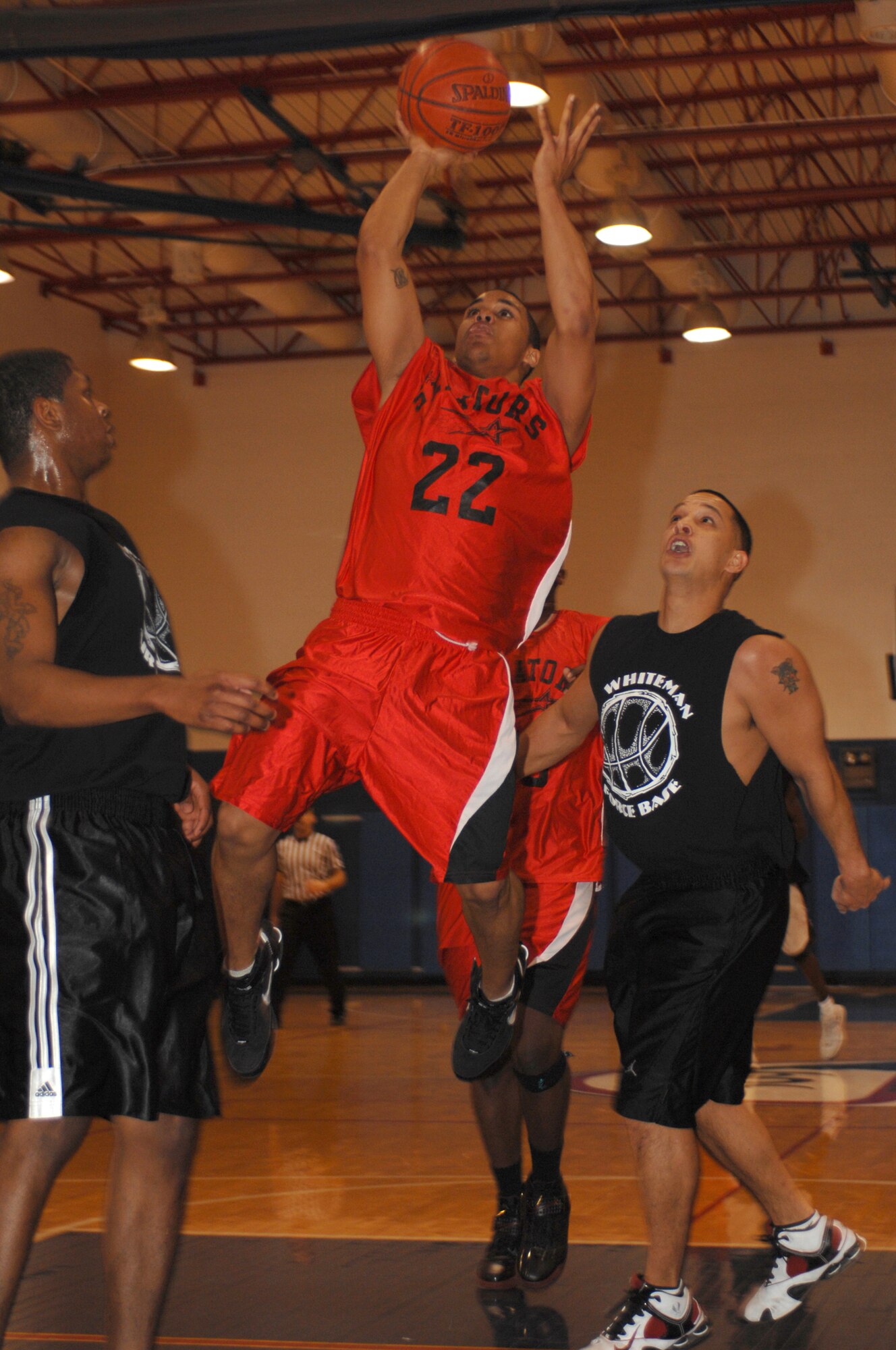 WHITEMAN AIR FORCE BASE, Mo. - Airman 1st Class Rodney Martin, 82nd Training Wing, Sheppard Air Force Base, Texas, scores during a game against Whiteman held at the base gym Jan. 12. Sheppard beat Whitman 115-97 Jan 12.  Whiteman came back Jan. 13 and defeated Sheppard with a score of 82-78 bringing their record to 4 and 6. (U.S. Air Force photo/Airman 1st Class Jessica Snow)