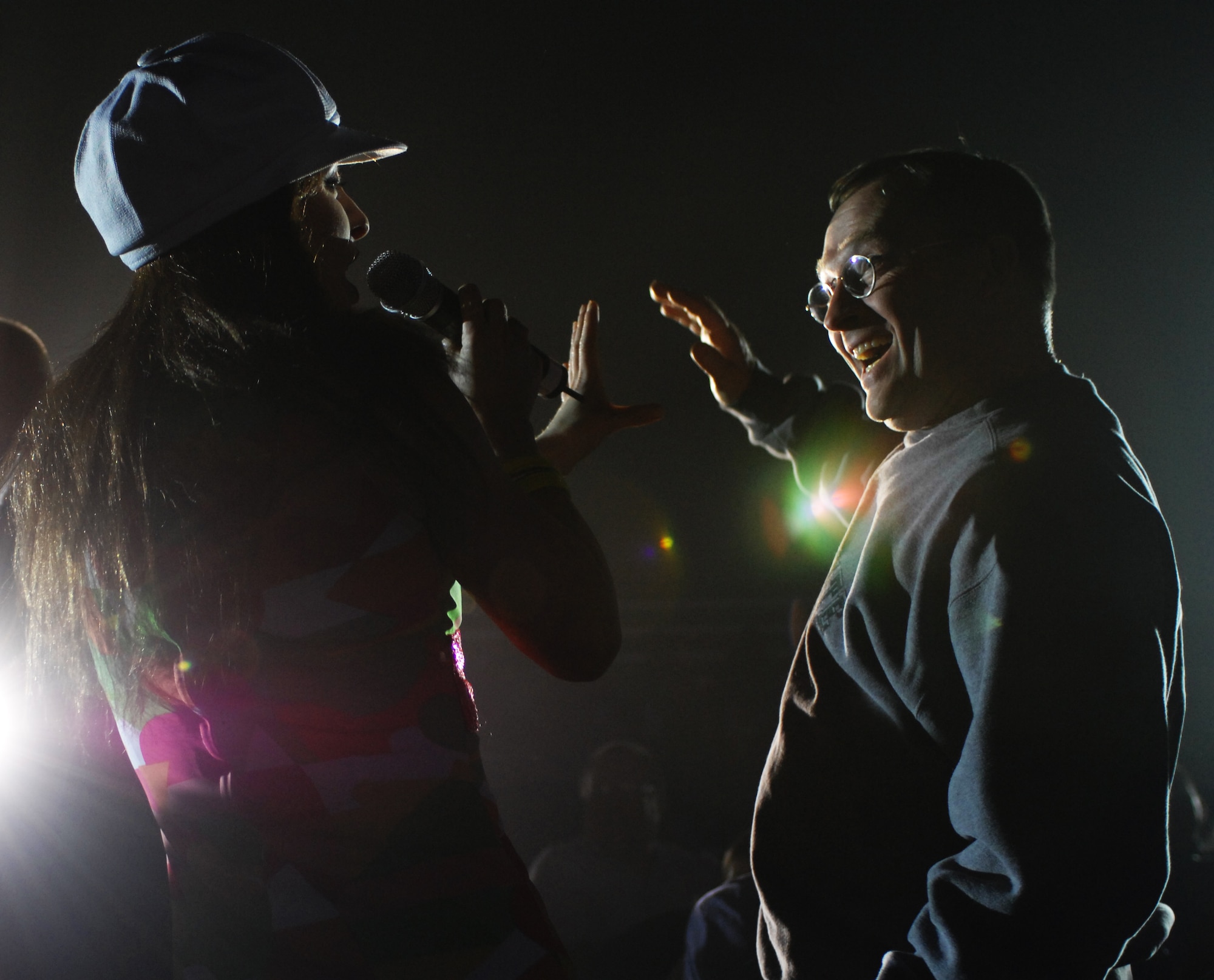 MOUNTAIN HOME AIR FORCE BASE, Idaho -- 1st Lt. Kimberly Robinson dances with an audience member during the Jan. 15 Tops in Blue show in Hangar 201 here. During the performance, Gunfighters welcomed back two performers who left Mountain Home Air Force Base a year earlier to start a one-year tour with the group. Senior Airman Benjamin Taylor, 366th Civil Engineer Squadron, and Tech. Sgt. Jennifer Dack, 366th Mission Support Squadron, were selected to join the team of singers, dancers, instrumentalists and stage hands who sing and dance their way through an average of 120 performances at 100 locations each year. The two Airmen first received news of their selection for the 2007 Tops in Blue team on Nov. 16, 2006, and have been touring around the world since. They returned here to perform the “The Fly-By,” A Musical Tribute to 60 Years of Proud Air Force History to Gunfighters. (U.S. Air Force photo/Airman 1st Class Ryan Crane)