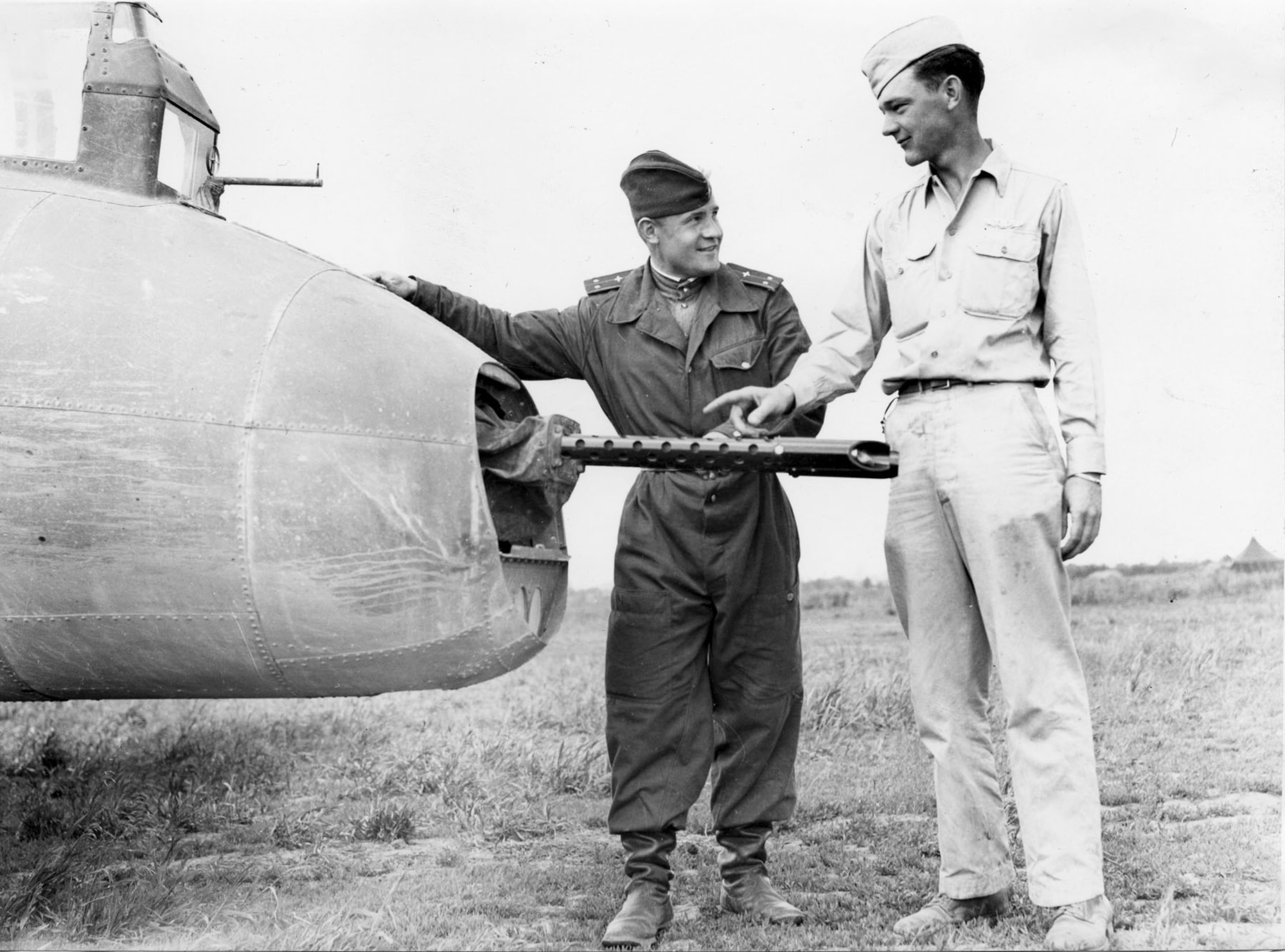 Lt. Vorokev of the Soviet Air Force inspects the tail gunner position of SSgt. Thomas Summers' B-17 Flying Fortress. (U.S. Air Force photo)