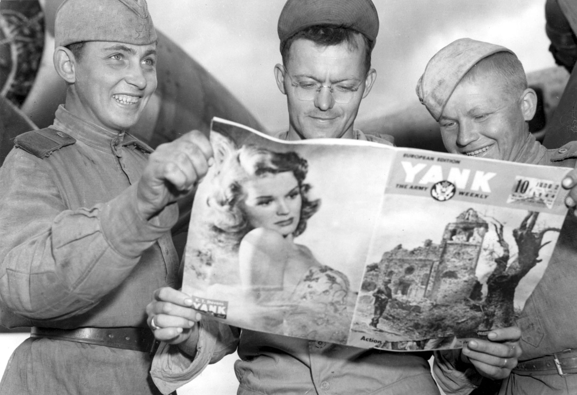 Two unidentified Russian soldiers look at Cpl. Thomas Klopack's "Yank" Magazine. (U.S. Air Force photo)