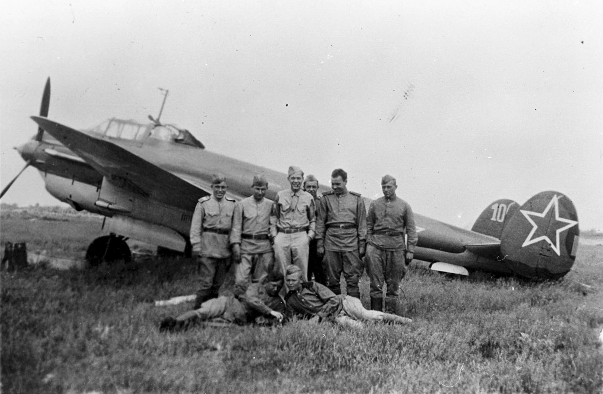 Russian pilots and ground crew stand in front of a Petlyakov Pe-2 light bomber at Poltava, Russia, during the first shuttle raid -- Italy to Russia and return -- in June 1944. GI is TSgt. Bernard J. McGuire, Tonawanda, N.Y., of the 348th Bomb Squadron, 99th Bomb Group. (U.S. Air Force photo)