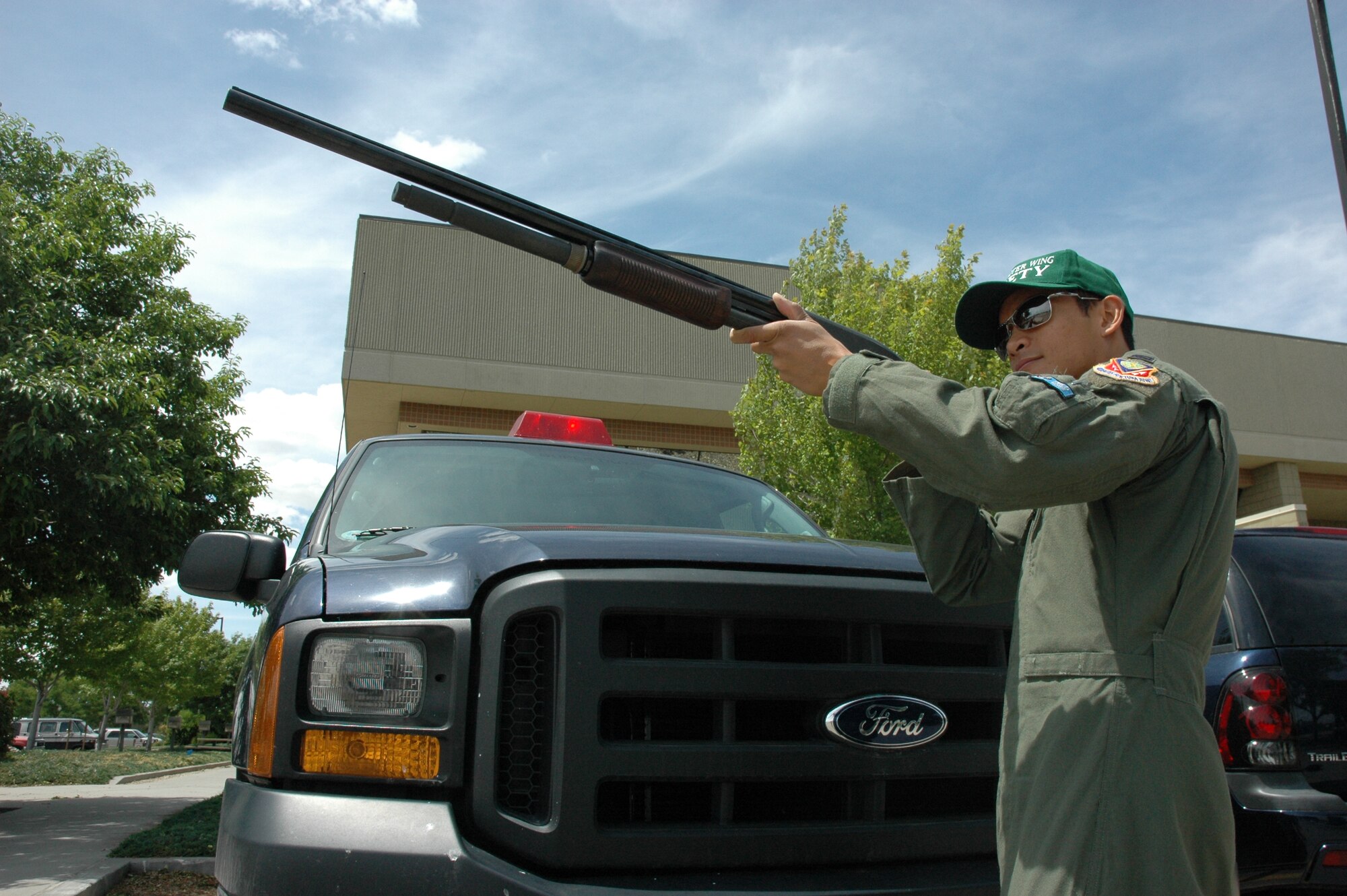 MOUNTAIN HOME AIR FORCE BASE, Idaho -- Capt. Julius Romasanta, 366th Fighter Wing Flight Safety Officer, checks out a shotgun before heading out for a Bird and Wildlife Aircraft Strike Hazard mission to prevent aircraft bird strikes at Mountain Home AFB. Captain Romasanta was recently named the 2007 Air Combat Command Flight Safety Officer of the Year for his efforts here and while deployed to Camp Lemonier, Djibouti. (U.S. Air Force photo courtesy of 366th Fighter Wing Public Affairs)