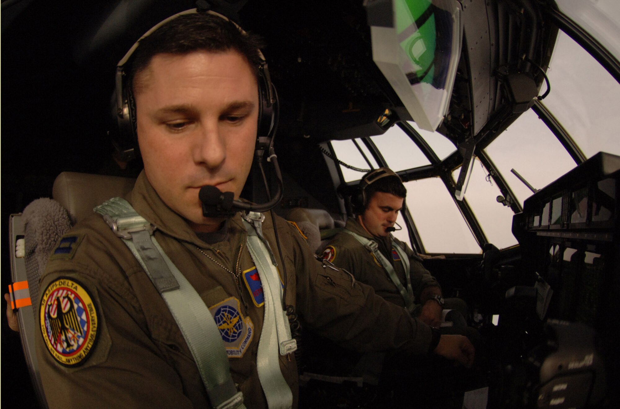 C-130J pilot, Capt. Kevin McDonnell, reads a map while enroute to Aviano Air Base, Italy. The Rhode Island Air National Guardsman is part of Rhode Island-based crew who are TDY to the 38th Airlift Squadron at Ramstein from the 143rd Airlift Wing at Quonset State Airport near Providence, R.I. Photo by Master Sgt. Scott Wagers / (released)