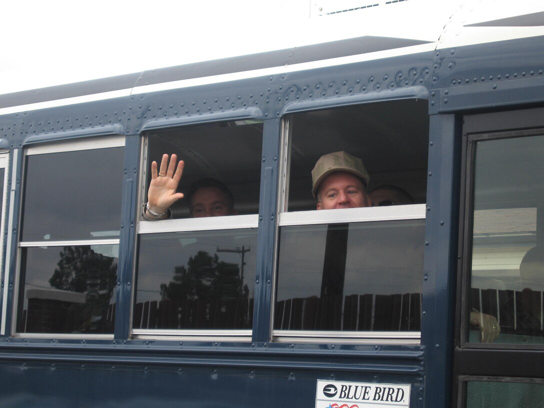 SEYMOUR JOHNSON AIR FORCE BASE, N.C.--Members of the 916th Civil Engineer Squadron, Chief Douglass Willis and Master Sgt. John Hahn waved goodbye before the long ride to Baltimore Washington International Airport, Maryland.  Once in at the airplort they will be boarding a plane to Iraq.  Chief Willis is 916th CES fire chief and Sergeant Hahn is the 916th CES assistant non-commissioned officer in charge of force management. U.S. Air Force photo/A1C Emily Bruckner