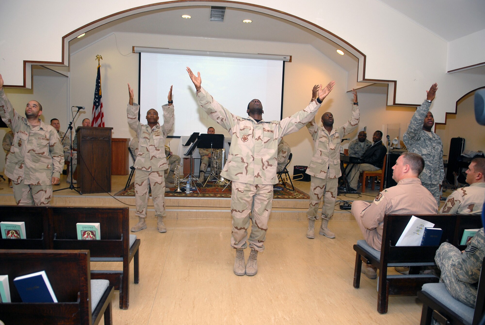SOUTHWEST ASIA-- The  379th Air Expeditionary Wing Victory Chapel's Men's Praise Dancing Team performs for an audience at the Martin Luther King Jr. Celebration Jan. 15 at a Southwest Asia air base. The celebration included song selections by the Community Choir, remarks by Chaplain (Capt.) Corwin Smith and music selections by the US CENTAF band "Hot Brass". (U. S. Air Force photo/Senior Airman Domonique Simmons)