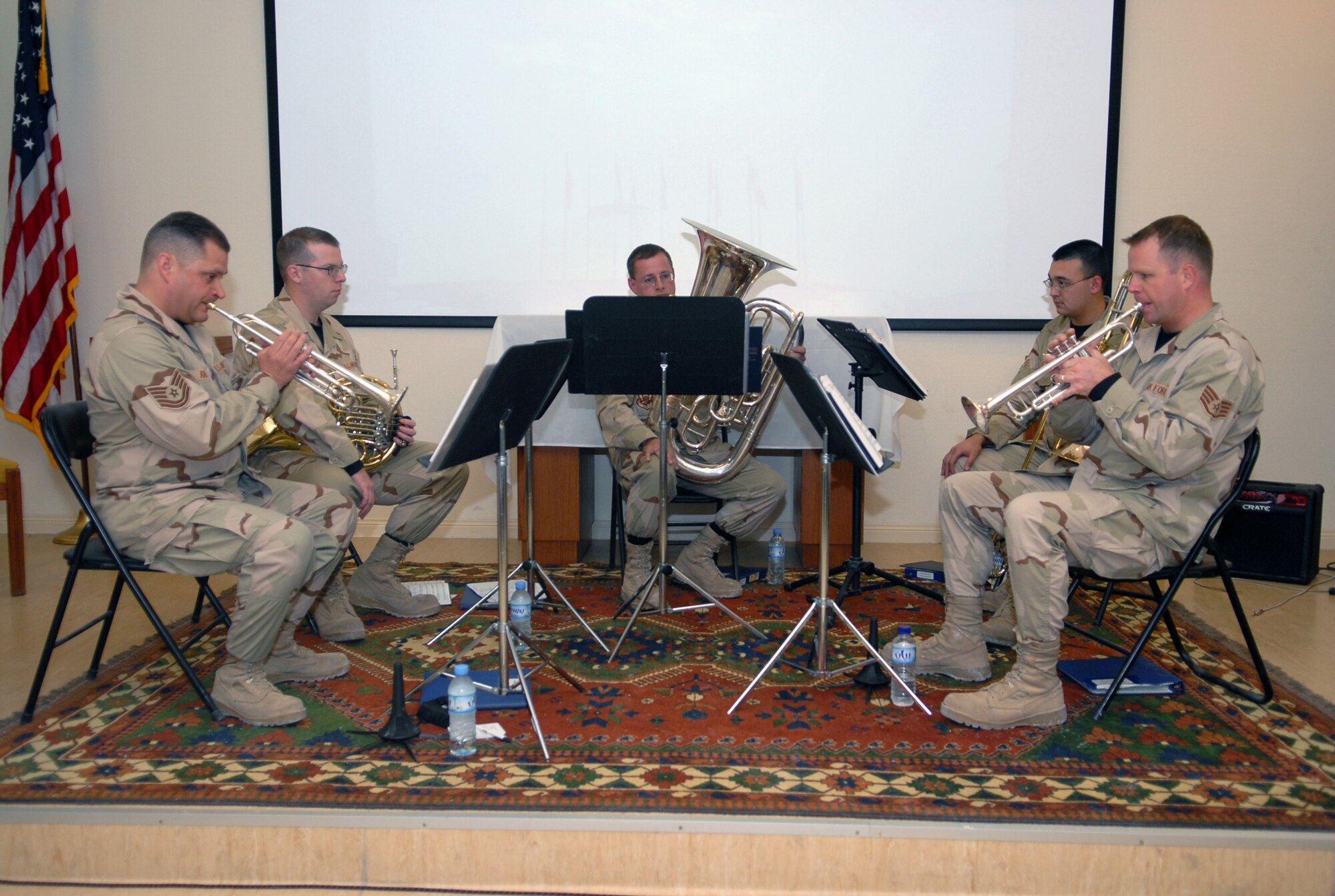 SOUTHWEST ASIA-- The United States Central Air Forces traveling band "Hot Brass" plays a musical selection for the 379th Air Expeditionary Wing's Marting Luther King Jr. celebration held at the Victory Chapel Jan. 15 at a Southwest Asia air base. (U. S. Air Force photo/Senior Airman Domonique Simmons)