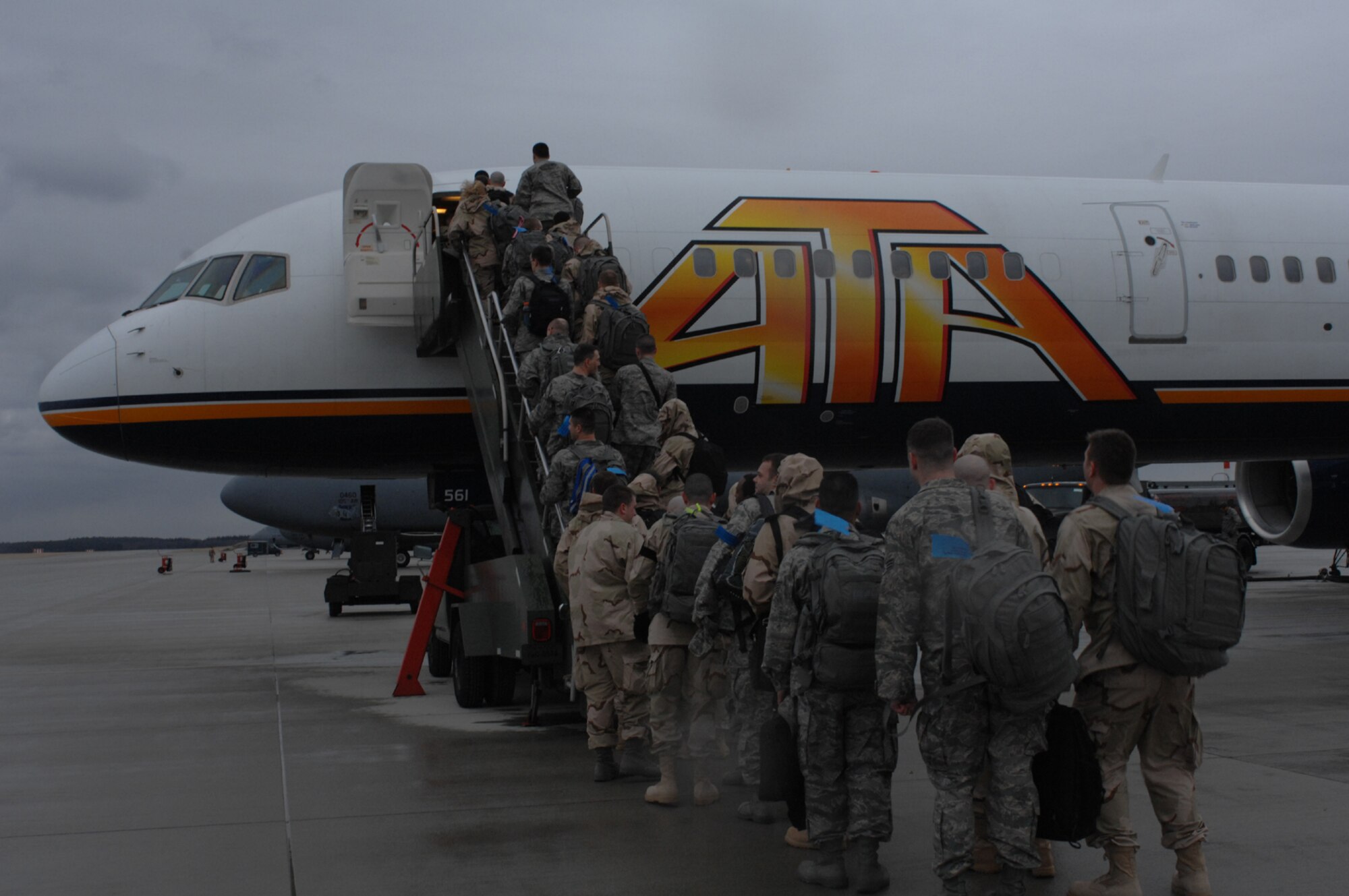 SPANGDAHLEM AIR BASE, Germany – Deploying Airmen board a plane that will take them into the area of responsibility Jan. 15, 2008. The Airmen are deploying to numerous bases throughout the Middle East. (U.S. Air Force photo/Airman 1st Class Jenifer Calhoun)