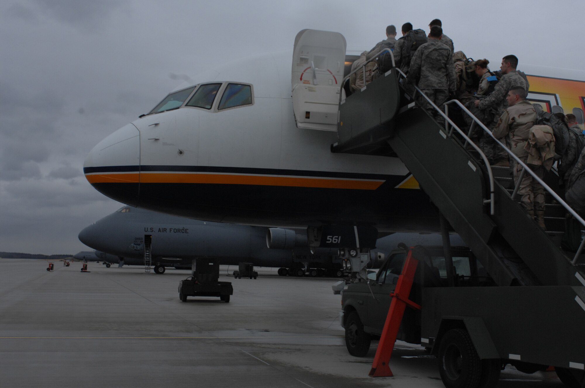 SPANGDAHLEM AIR BASE, Germany – Deploying Airmen board a plane that will take them into the area of responsibility Jan. 15, 2008. The Airmen are deploying to numerous bases throughout the Middle East. (U.S. Air Force photo/Airman 1st Class Jenifer Calhoun)