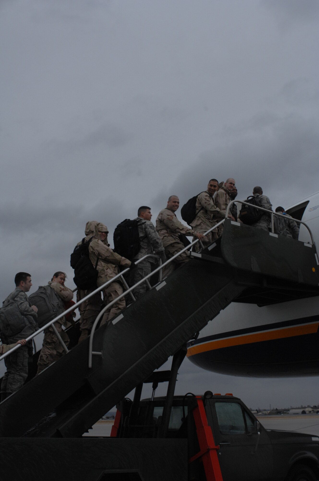 SPANGDAHLEM AIR BASE, Germany – Airmen from the 52nd Communications Squadron, 606th Air Control Squadron and Ramstein Air Base, Germany, take a last look at the German scenery before climbing on a plane. The Airmen are deploying to numerous bases throughout the Middle East. (U.S. Air Force photo/Airman 1st Class Jenifer Calhoun)