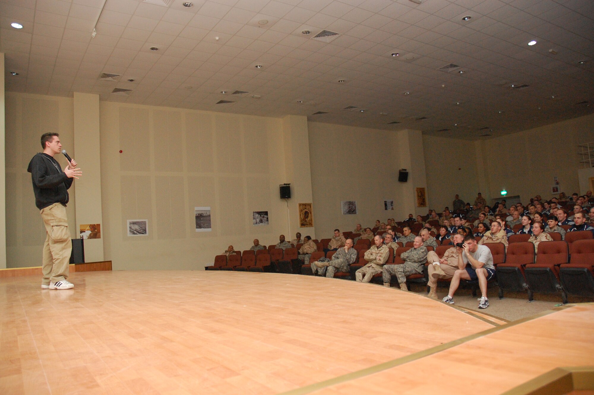 Jesse Joyce, a comedian on the Comics on Duty World Tour, entertains Airmen Jan. 15, 2007, during a show at an air base in the Persian Gulf Region. (U.S. Air Force photo/Capt Jason L. McCree) (Released)