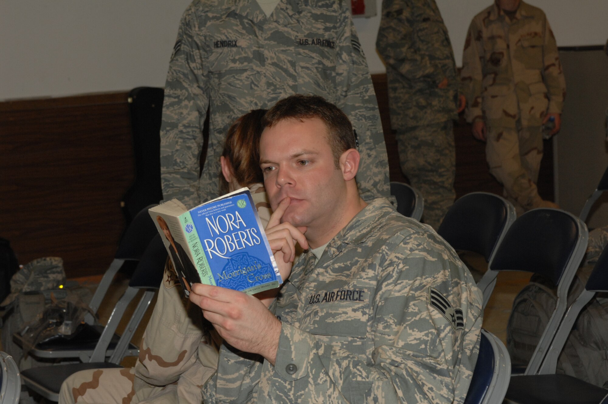 SPANGDAHLEM AIR BASE, Germany – Senior Airman Shane Reed, 606th Air Control Squadron, reads a book as he waits for a bus at the mobility building Jan. 15, 2008. Airman Reed is one of several Airmen from the base deploying to the Middle East as part of the current air and expeditionary force rotation. (U.S. Air Force photo/Airman 1st Class Jenifer Calhoun)