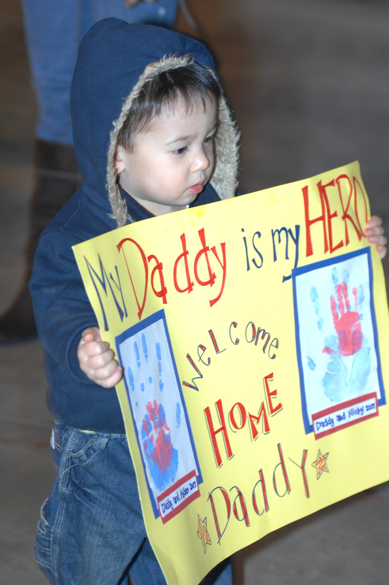 AVIANO AIR BASE, Italy-- Nick Siplak waits for his father Staff Sgt. Nicholas Siplak inside a hanger,  January 15, 2008, at Aviano AB, Italy.  Staff Sgt. Siplak and many other Airman are finally returning home after a long deployment.   (U.S. Air Force photo/Airman 1st Class Tabitha M. Mans) 