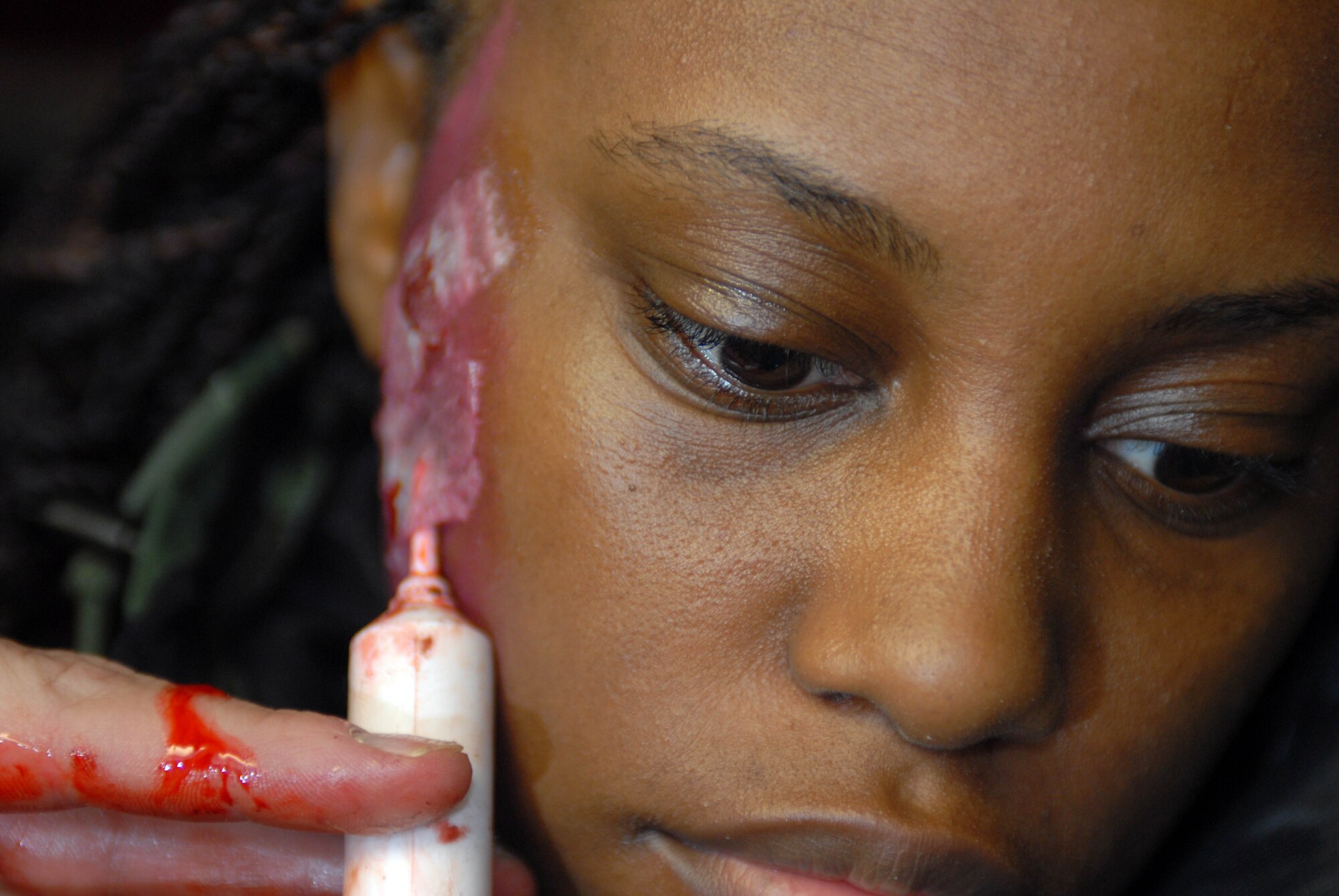 KUNSAN AIR BASE, South Korea -- Senior Airman Natesha Adams, 8th Medical Group, prepares for a mass causality scenario during the peninsula wide operations readiness exercise here Jan. 16. This is the first training scenario between the ROKAF and 8th Medical Group and demonstrates the teamwork necessary to carry out the combined mission of the two allies stationed at Kunsan. (U.S. Air Force photo/Senior Airmen Steven R. Doty)