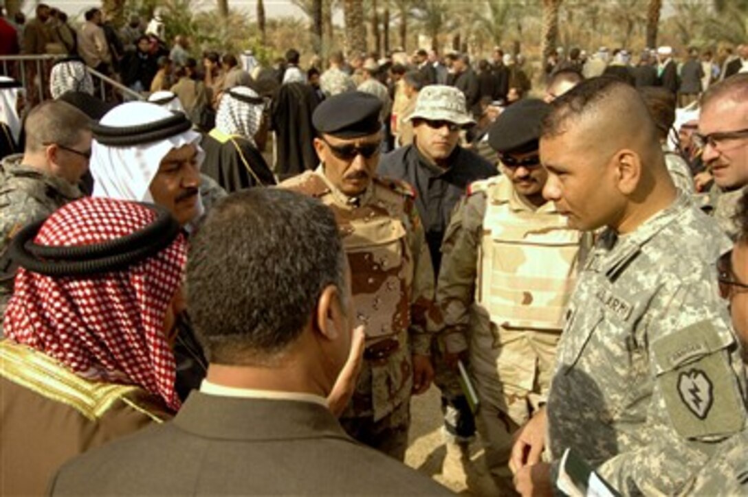 U.S. Army Lt. Col. Phillip Wilson (right) talks with key council members and sheiks during a conference in Taji, Iraq, on Jan. 10, 2008.  Wilson is the commander of 1st Battalion, 27th Infantry Regiment, 2nd Stryker Brigade Combat Team, 25th Infantry Division.  