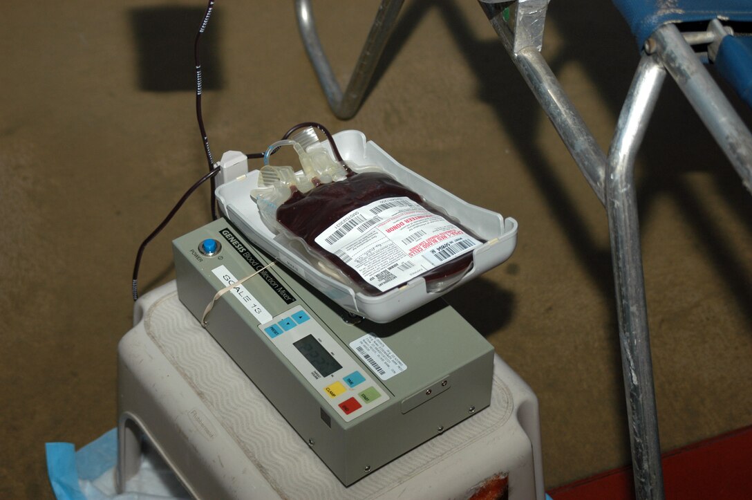 A pouch slowly fills with a recruit's blood during a collection event at the All Weather Training Facility. Depot recruits are offered the chance to donate blood to fellow troops on their ninth Sunday of training.