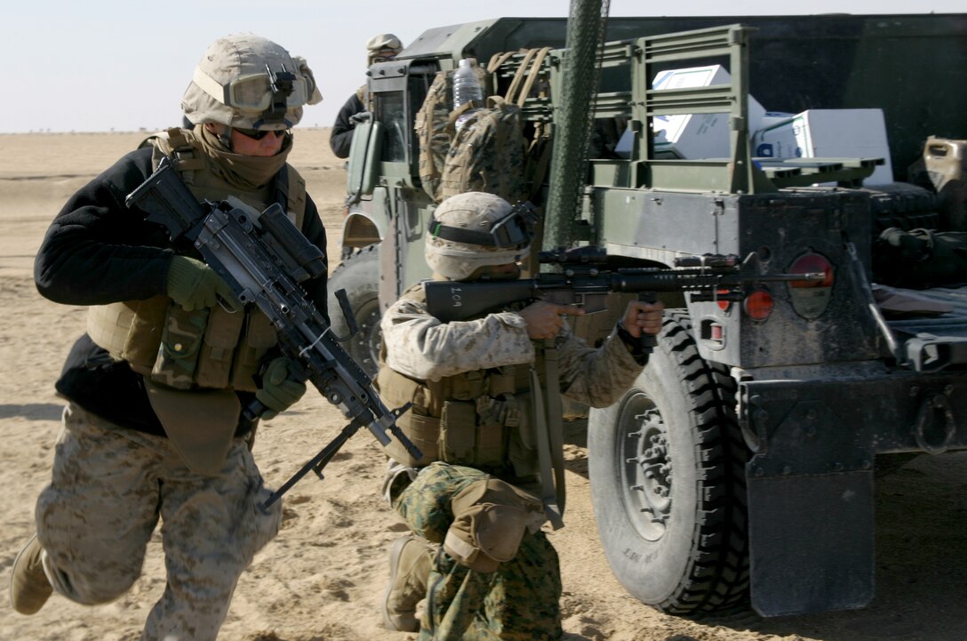 A Marine with Weapons Company, Battalion Landing Team 1st Battalion, 5th Marine Regiment, 11th Marine Expeditionary Unit, Camp Pendleton, Calif., advances during an individual movement training exercise at the Udairi Range Complex during sustainment training in Kuwait Jan. 17.