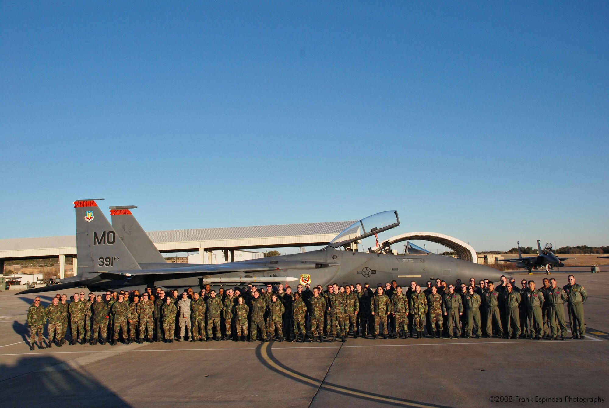 MOUNTAIN HOME AIR FORCE BASE, Idaho -- More than 100 Mountain Home AFB Airmen pose for a group shot in front of an F-15E. The Airmen, along with 13 security forces Airmen from Dyess AFB, Texas, and seven jets from the 391st Fighter Squadron, deployed to Robert Gray Army Airfield at Fort Hood, Texas, as part of Operation Noble Eagle. The Airmen left Dec. 20 to provide air cover for the President during his Christmas vacation at his ranch in Crawford, Texas. The Airmen returned Jan. 2. (U.S. Air Force photo/ Tech. Sgt. Frank Espinoza)