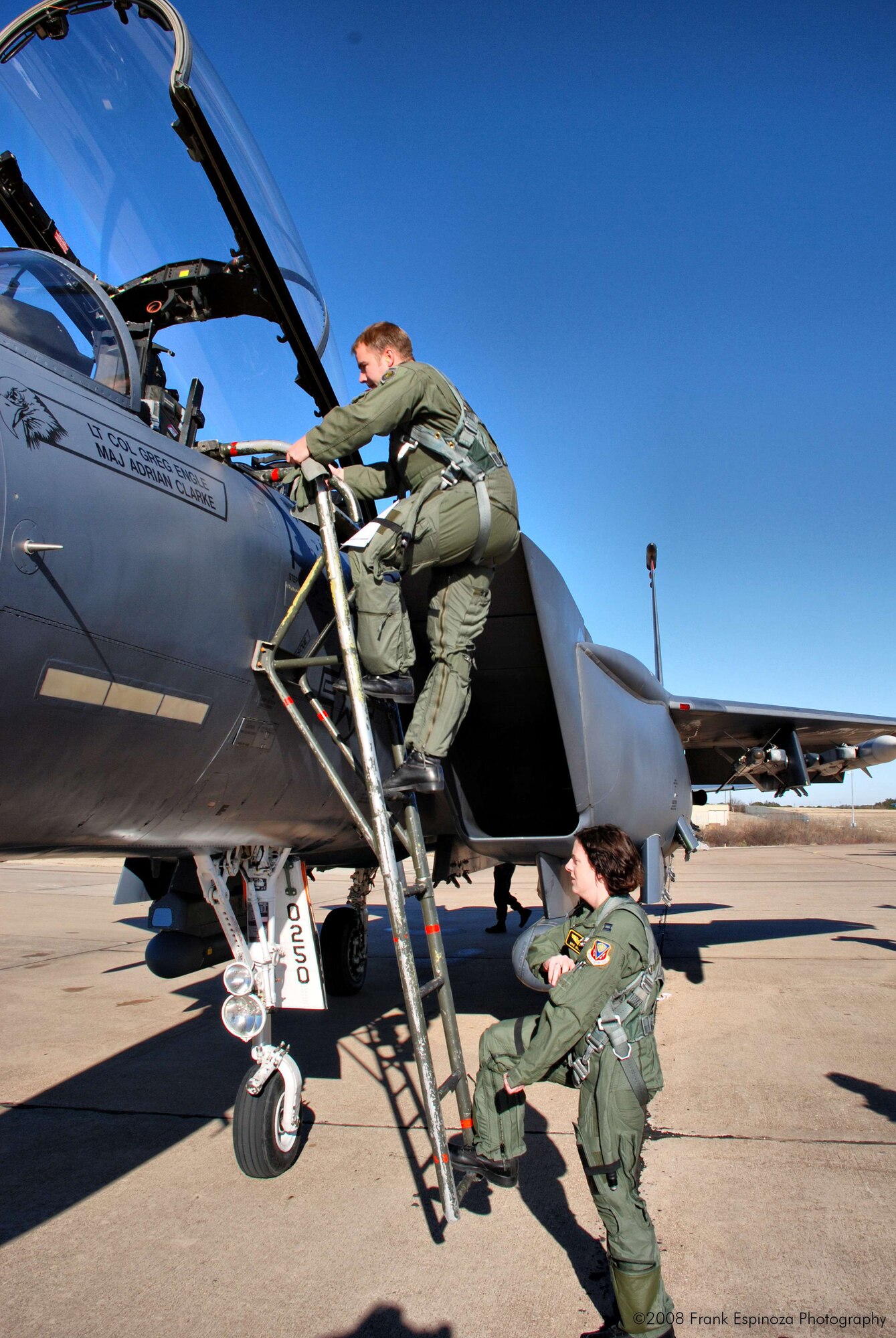 MOUNTAIN HOME AIR FORCE BASE, Idaho -- Capt. Aaron Lapp, a 389th Fighter Squadron pilot and Capt. Brie Wilson, a 391st Fighter Squadron navigator, climb into the cockpit of an F-15E as they prepare to fly a mission. 100 Airmen from Mountain Home AFB deployed to Robert Gray Army Airfield at Fort Hood, Texas, as part of Operation Noble Eagle. The Airmen left Dec. 20 to provide air cover for the President during his Christmas vacation at his ranch in Crawford, Texas. The Airmen returned Jan. 2. (U.S. Air Force photo/ Tech. Sgt. Frank Espinoza)