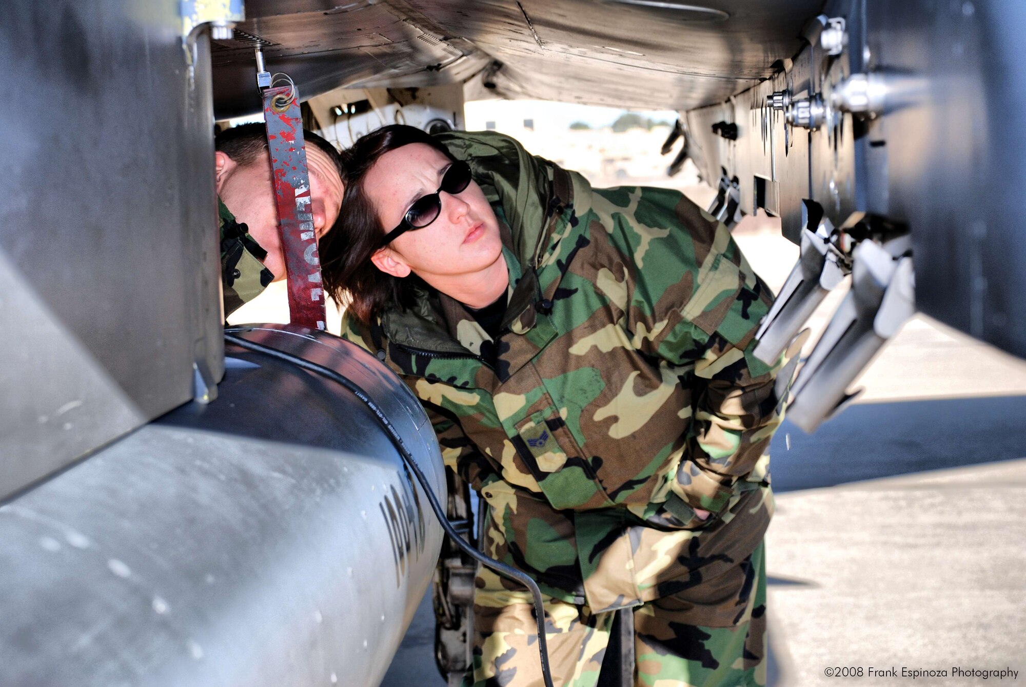 MOUNTAIN HOME AIR FORCE BASE, Idaho -- Senior Airman Erin James, along with her husband, Staff Sgt. Matthew James, both from 366th Component Maintenance Squadron, inspect an F-15E. 100 Airmen from Mountain Home AFB deployed to Robert Gray Army Airfield at Fort Hood, Texas, as part of Operation Noble Eagle. The Airmen left Dec. 20 to provide air cover for the President during his Christmas vacation at his ranch in Crawford, Texas. The Airmen returned Jan. 2. (U.S. Air Force photo/ Tech. Sgt. Frank Espinoza)