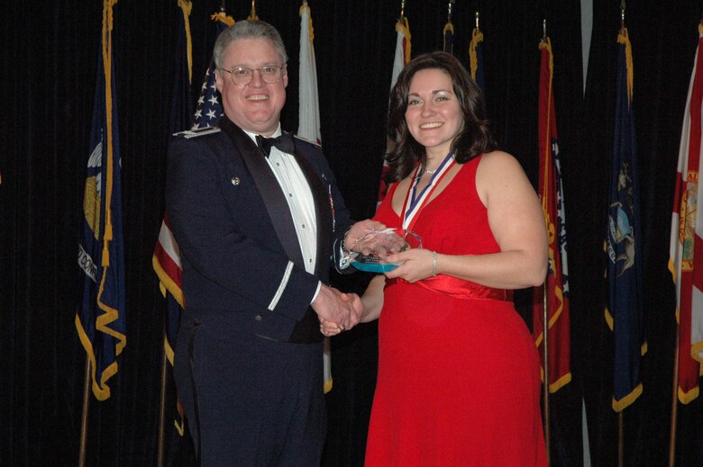 MCGUIRE AIR FORCE BASE, N.J. -- Lori Maldonado of the 514th Mission Support Squadron receives the 514th Air Mobility Wing Outstanding Civilian of the Year 2007 Award Category I from Commander Col. James L. Kerr Jan. 12 during the Reserve wing's 8th annual awards banquet. (U.S. Air Force photo/Senior Airman William P. O'Neil III)