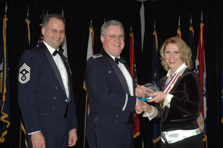 MCGUIRE AIR FORCE BASE, N.J. -- Judith Pates, right, of the 514th Mission Support Squadron receives the 514th Air Mobility Wing Outstanding Civilian of the Year 2007 Category II Award from Commander Col. James L. Kerr, middle and Command Chief Master Sgt. Michael J. Ferraro, left, Jan. 12 during the Reserve wing's 8th annual awards banquet. (U.S. Air Force photo/Senior Airman William P. O'Neil III)