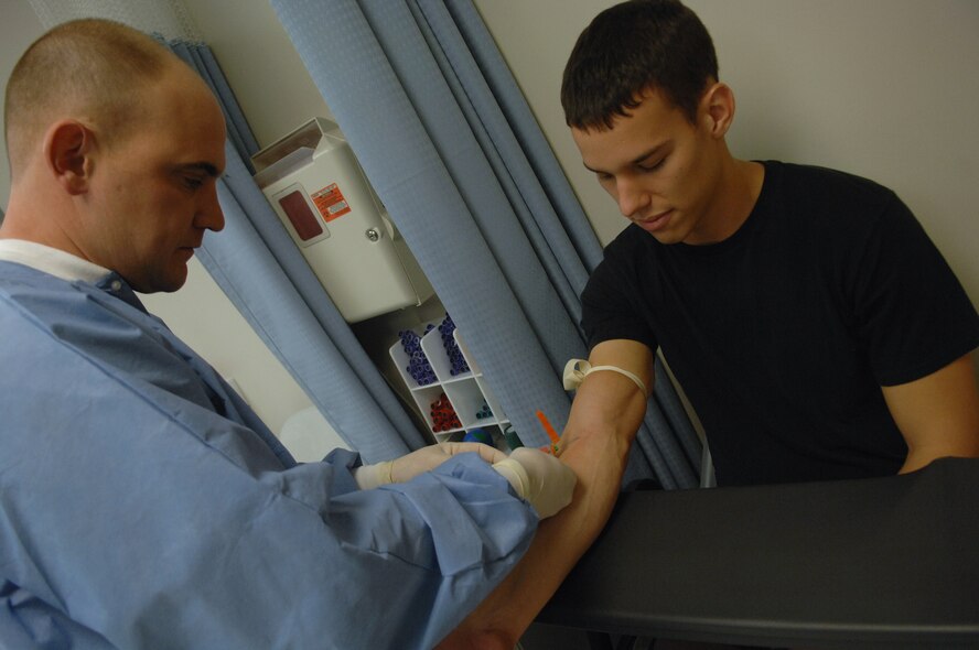 MOODY AIR FORCE BASE, Ga. -- Tech. Sgt. Scott Boggs, 23rd Medical Group laboratory technician,  draws blood from Airman 1st Class Stephen Callahan, 23rd Aircraft Maintenance Squadron avionics specialist, during his annual preventive health assessment Jan. 17 here. As of January 2008, the 23rd Wing has implemented a new format for the required medical examination. (U.S. Air Force photo by Airman 1st Class Brittany Barker) 