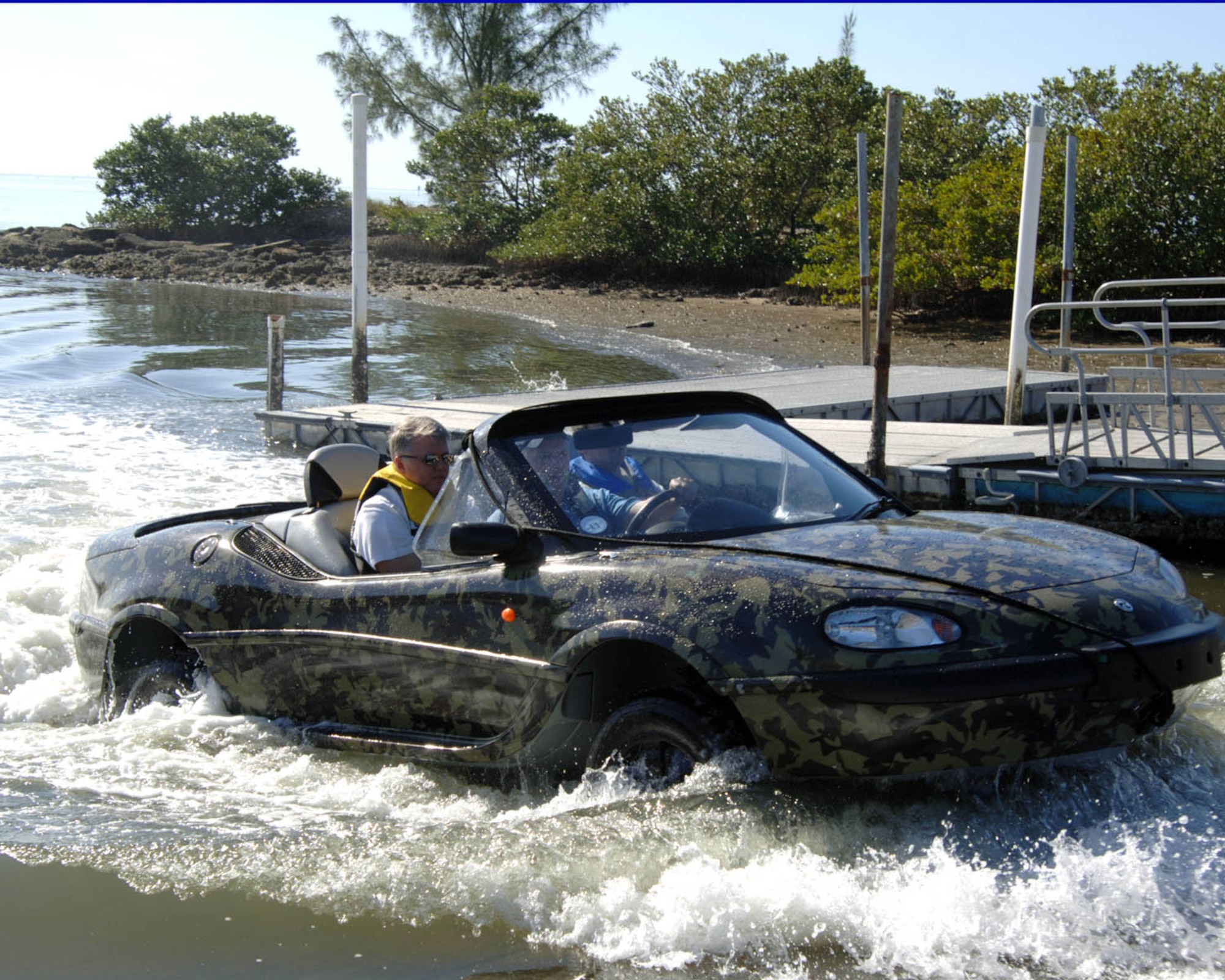 US Air Force SrA Esteban Rodriguez enjoys a ride on the Lockheed Martin/GIBBS high speed amphibian vehicle called the Humdinga driven by Mark Chrzanowski at the Marina on Macdill AFB, Florida, Jan 10, 2008.  The Humdinga is capable of reaching speeds of 80 miles per an hour on land and 40 miles per an hour on the water.

 (U.S. Air Force photo by Staff Sergeant Joseph Swafford, Jr.)(Released)