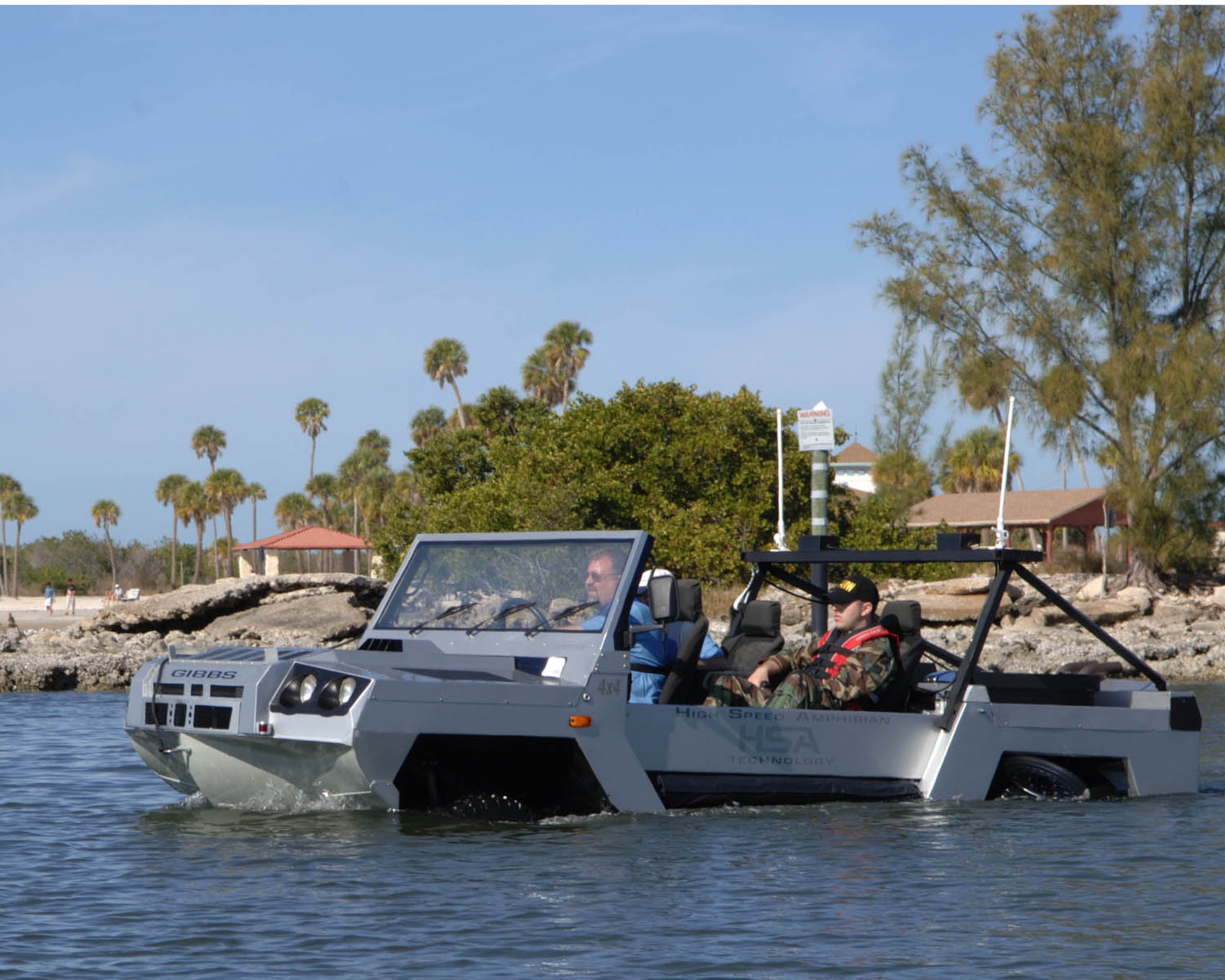 US Air Force SrA Esteban Rodriguez enjoys a ride on the Lockheed Martin/GIBBS high speed amphibian vehicle called the Humdinga driven by Mark Chrzanowski at the Marina on Macdill AFB, Florida, Jan 10, 2008.  The Humdinga is capable of reaching speeds of 80 miles per an hour on land and 40 miles per an hour on the water.

 (U.S. Air Force photo by Staff Sergeant Joseph Swafford, Jr.)(Released)