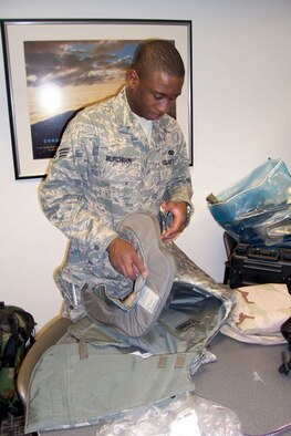 SrA Chris Murchison, 507th Air Refueling Wing Security Forces Squadron, makes some final adjustments on his flak vest in preparation for deployment to Iraq. Airman Murchison and approximately 40 fellow Air Force Reservists from Tinker Air Force Base, Oklahoma, are deploying.