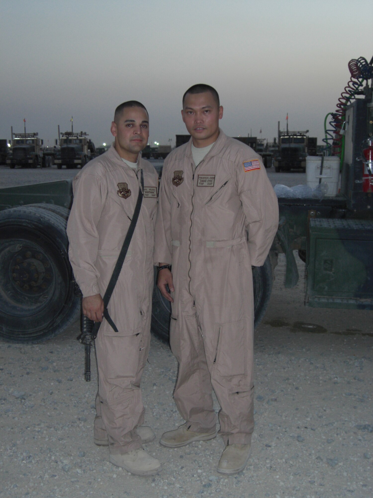 VANDENBERG AIR FORCE BASE, Calif. -- Tech Sgt. Fredrick Garcia (right), a 30th Logistics Readiness Squadron dispatch operations NCOIC stands with Tech Sgt. Raul Molina, a 30th LRS dispatch support NCOIC, during  a deployment to Iraq. Sergeant Garcia received a bronze star for his leadership as convoy commander in Iraq where he and his team drove a combined distance of 578,000 miles.(Air Force Photo)