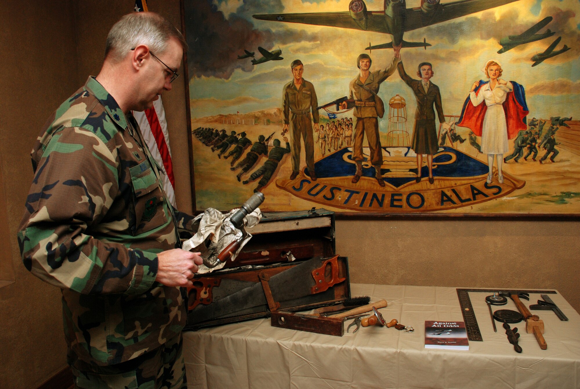 Lt. Col. Matthew Bobb, 366th Training Squadron commander, examines the contents of a World War II era carpenter's tool kit Jan. 16 at the Heritage Center. The tool kit was donated my Major Kuschel and will be put on display at the structural apprentice course school house at Det. 6 366th TRS in Gulfport, Miss. (U.S. Air Force photo/Airman 1st Class Jacob Corbin)